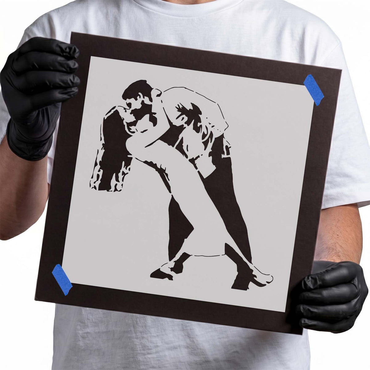 Romantic couple stencil with two figures dancing and sharing a kiss