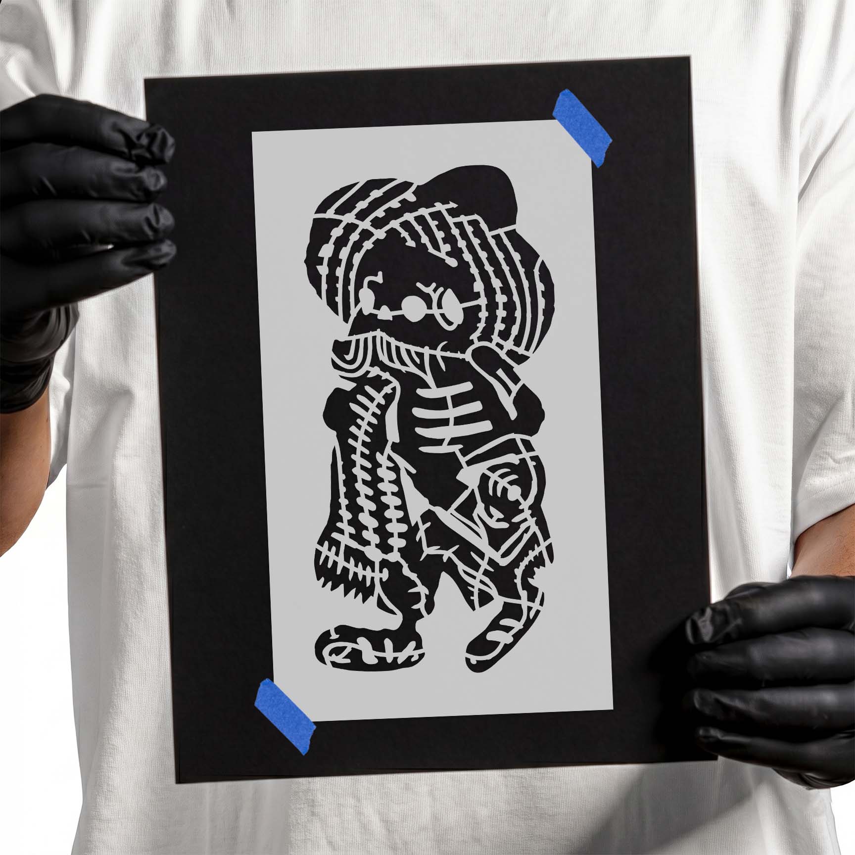 Person holding reusable Day of the Dead Cartoon Skeleton Stencil