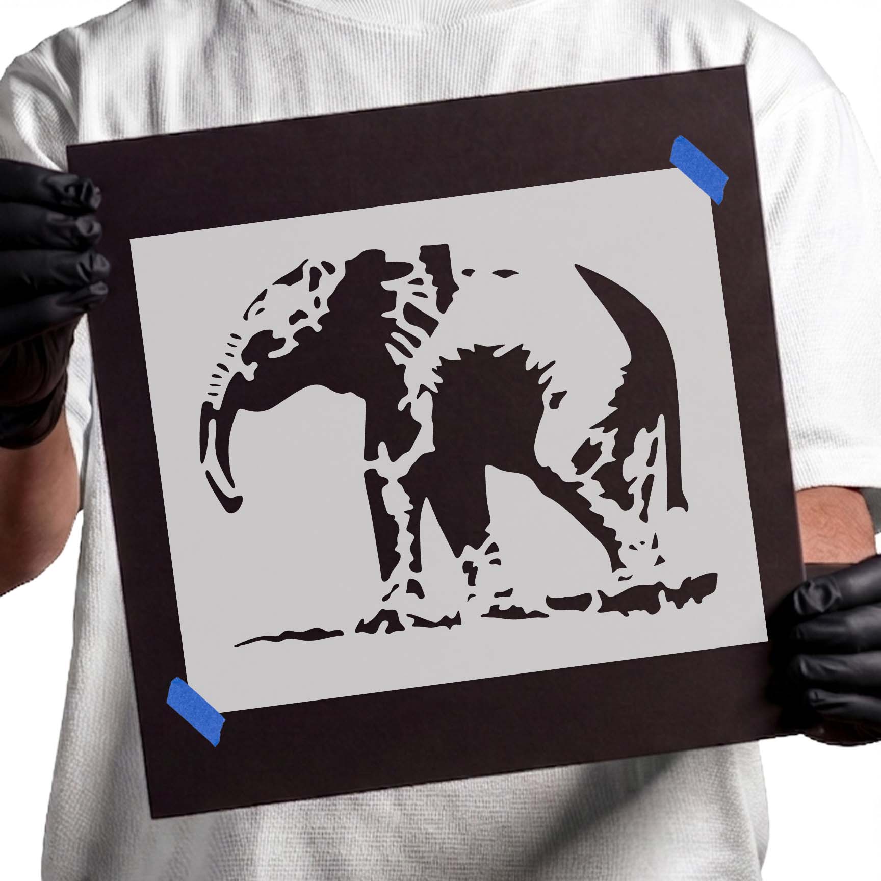 Detailed elephant stencil with curved tusk and sweeping trunk