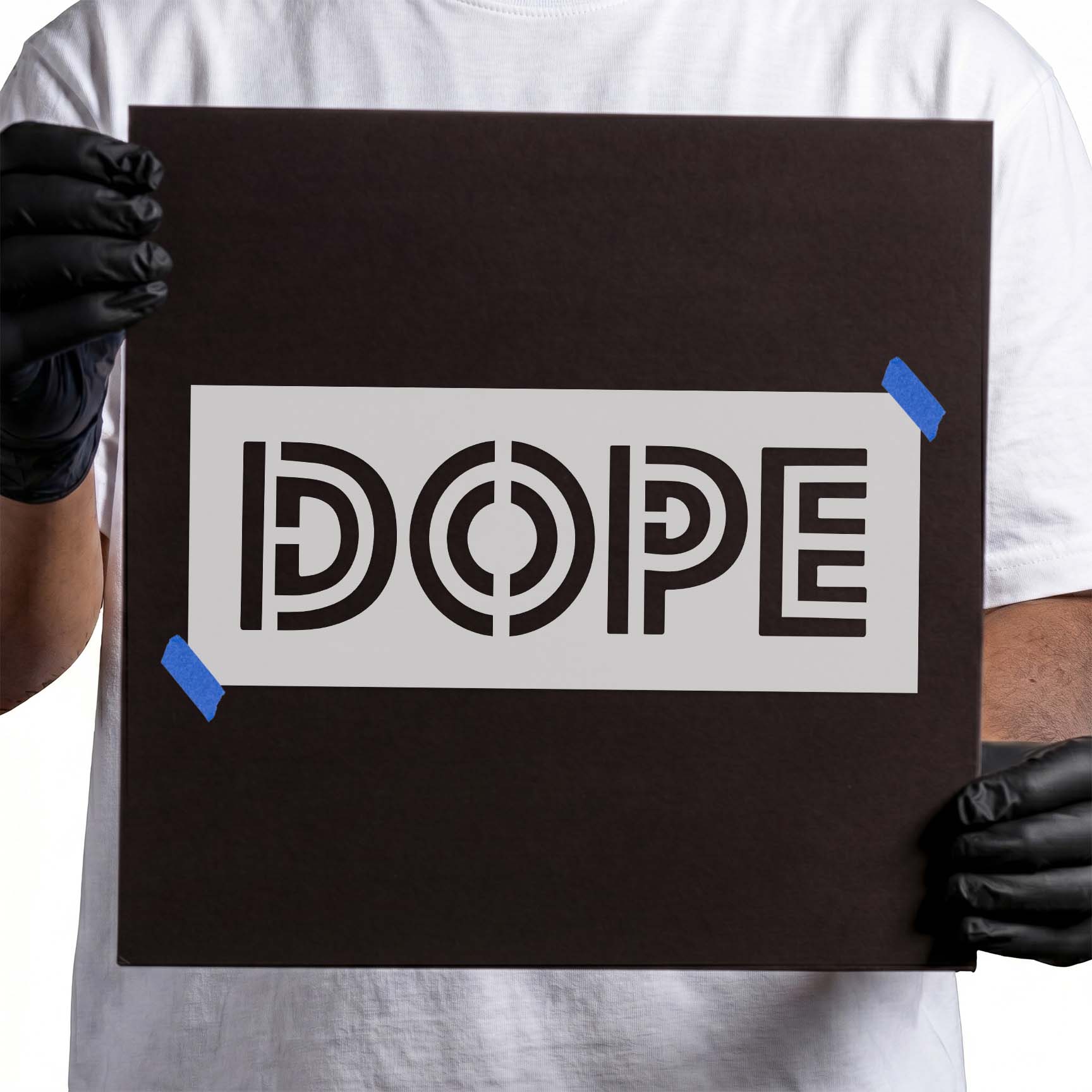 Person holding a reusable "Dope" Text Stencil