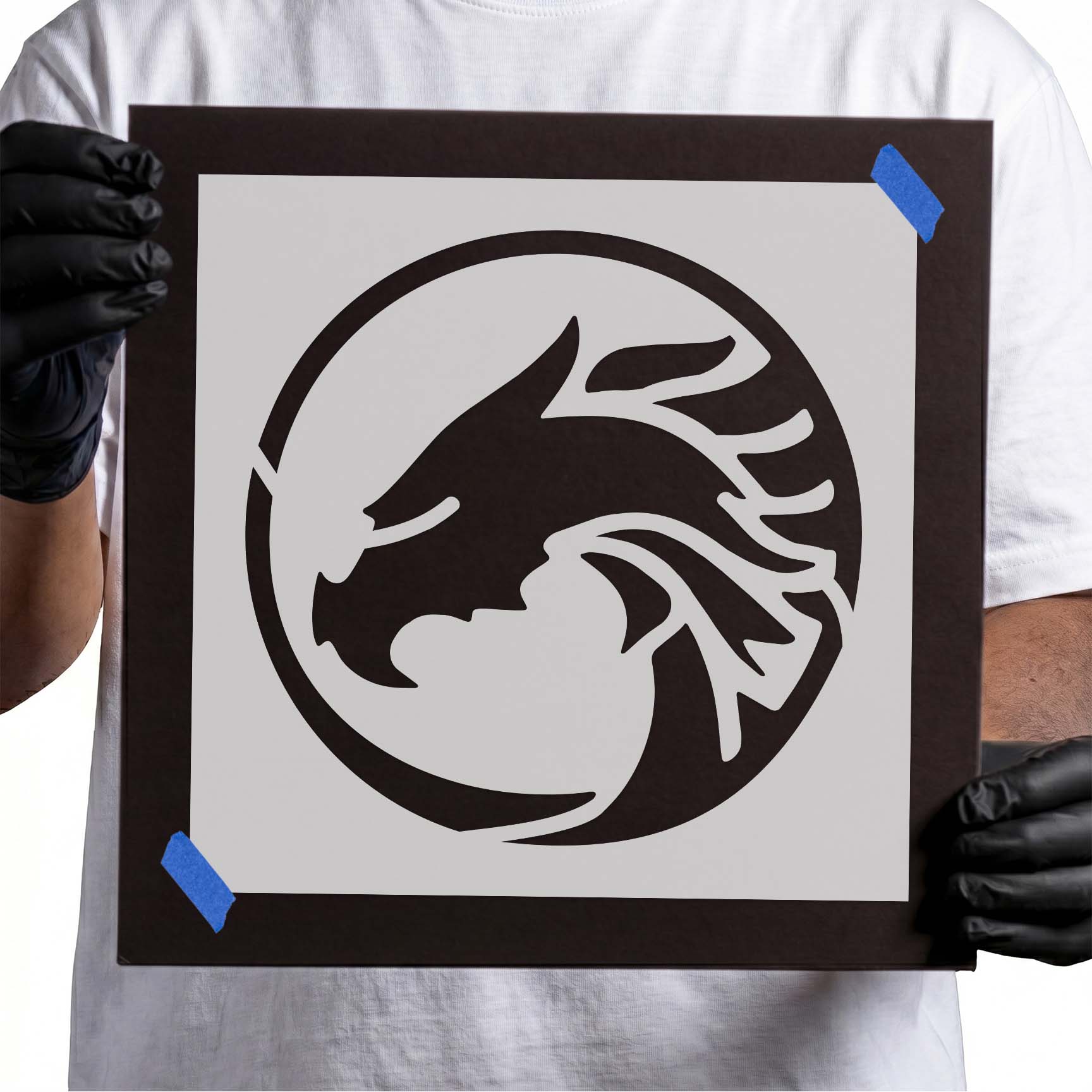 Circular dragon emblem stencil with sweeping wings and curled body