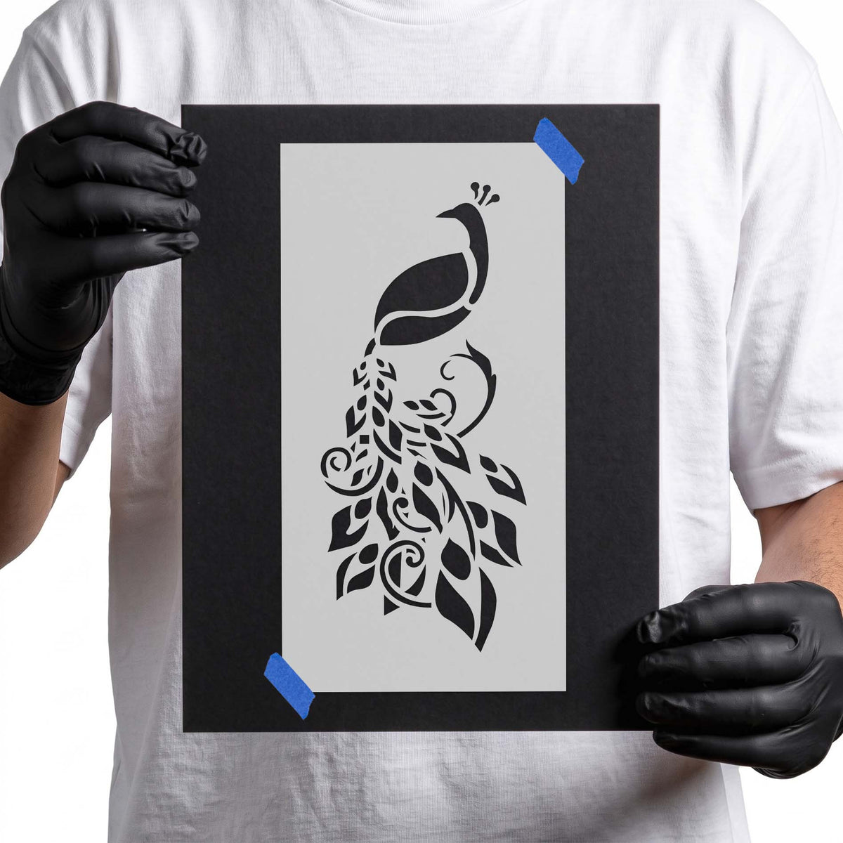 Decorative peacock stencil with flowing ornamental feather and leaf details
