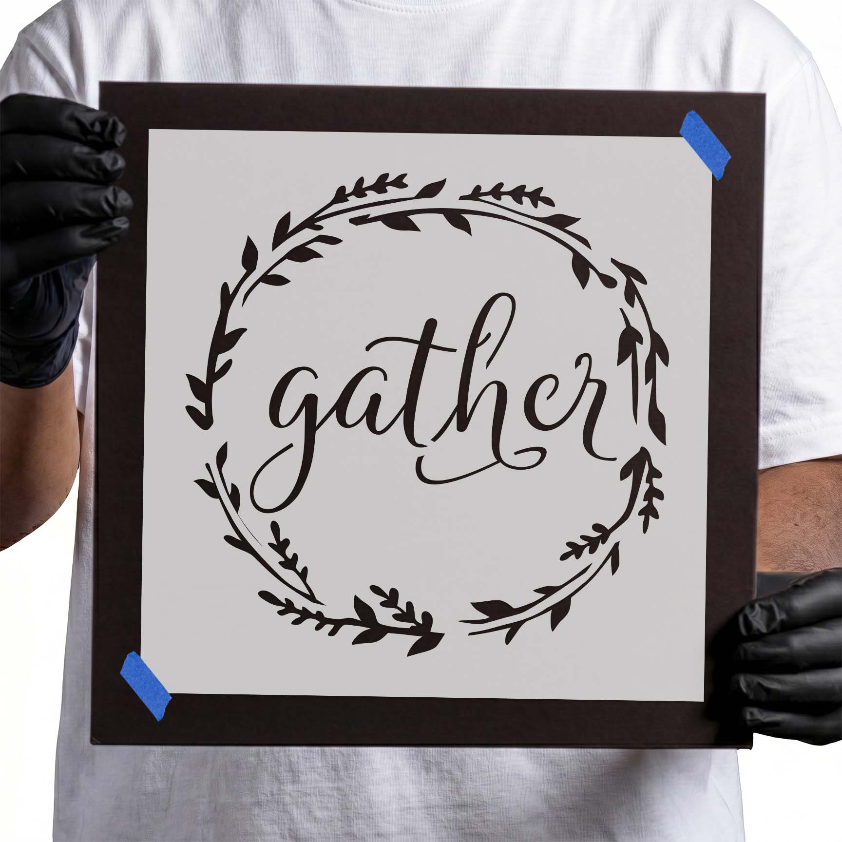 Gather stencil lettering surrounded by a circular leafy wreath