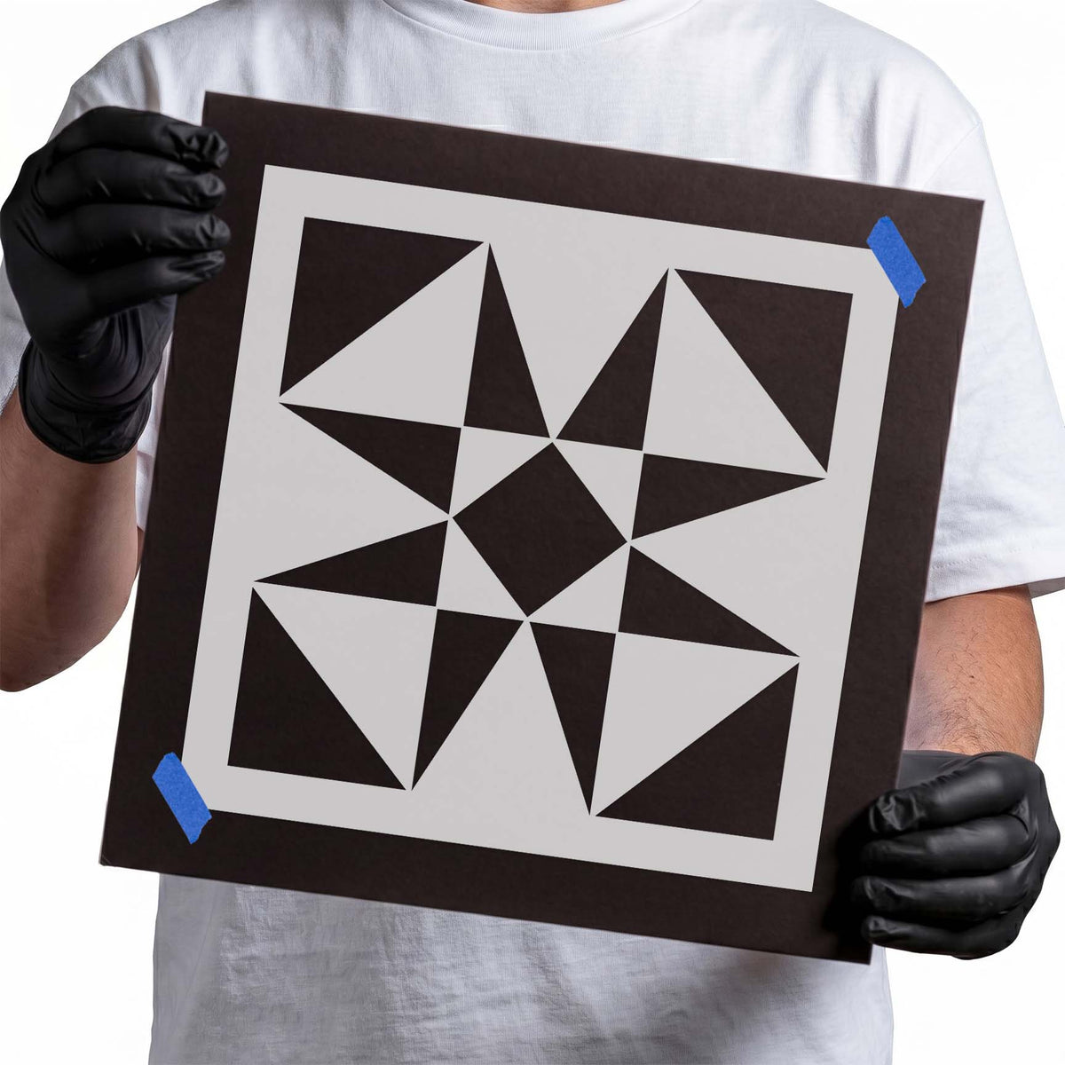 Geometric tile stencil with triangles, diamonds, and angular symmetrical shapes