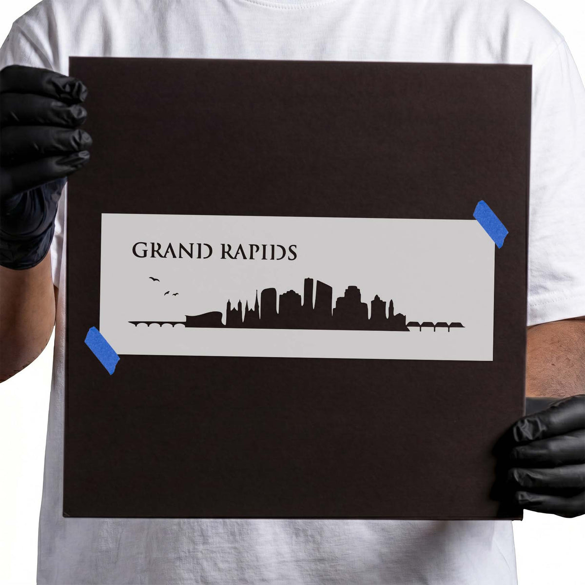 Grand Rapids stencil with city skyline, bridge details, and birds