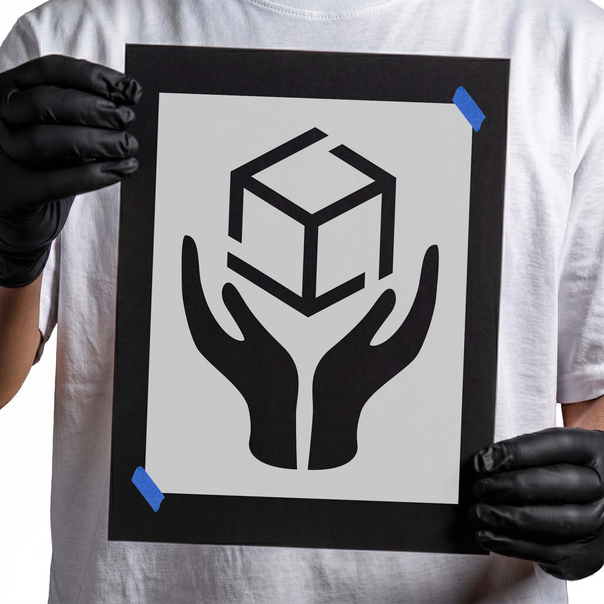 Handle with care stencil showing package above protective hands