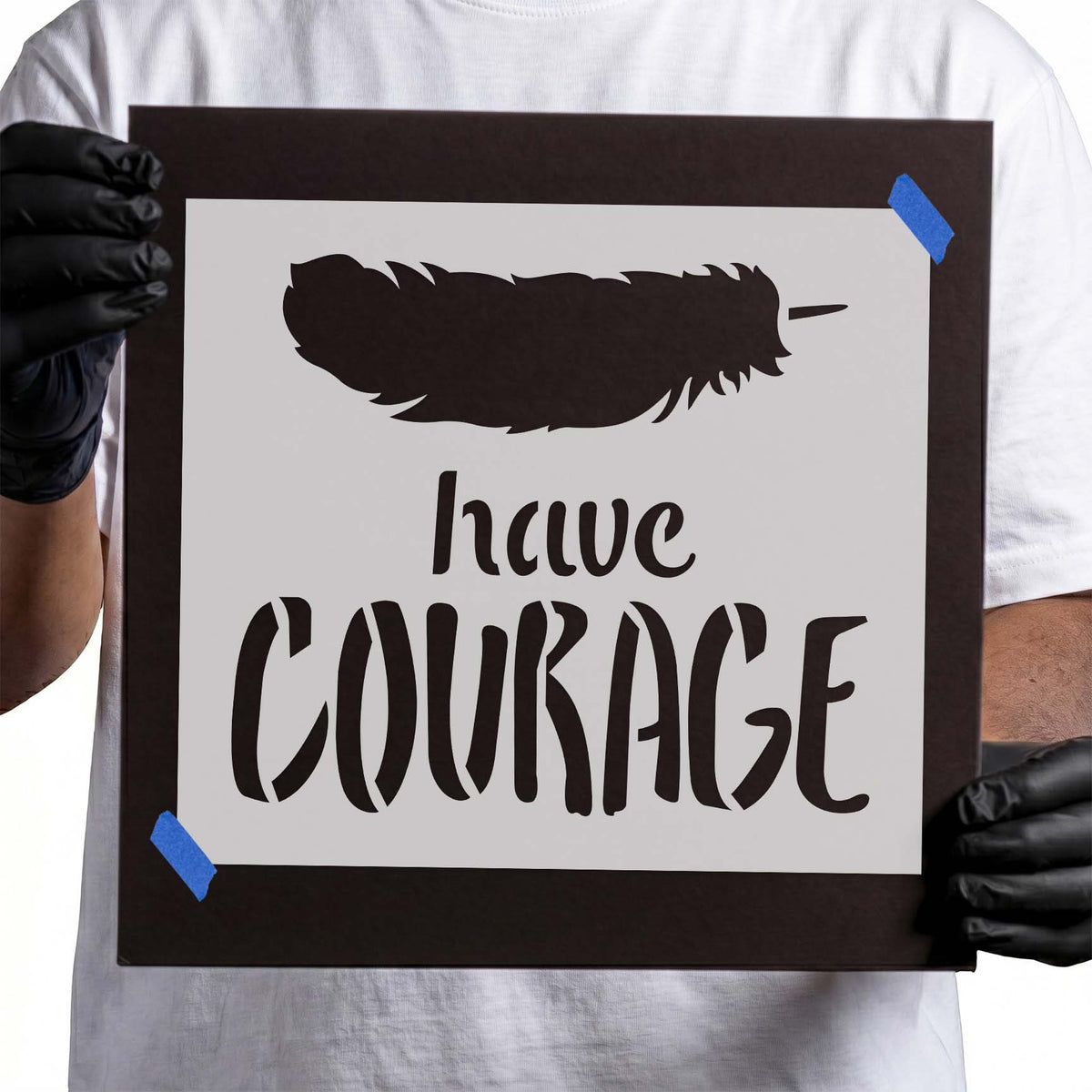 Have courage stencil lettering beneath a large feather silhouette