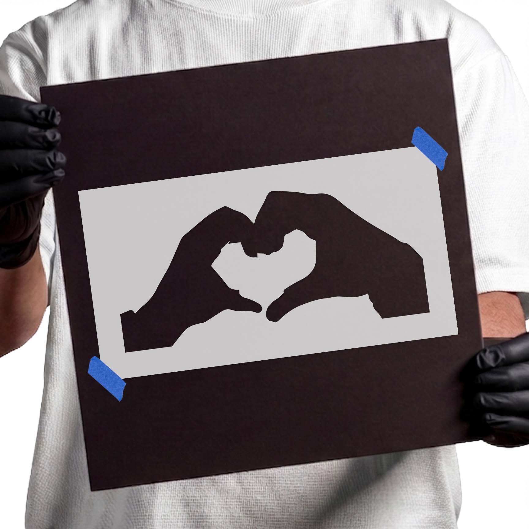 Hands forming a heart shape stencil