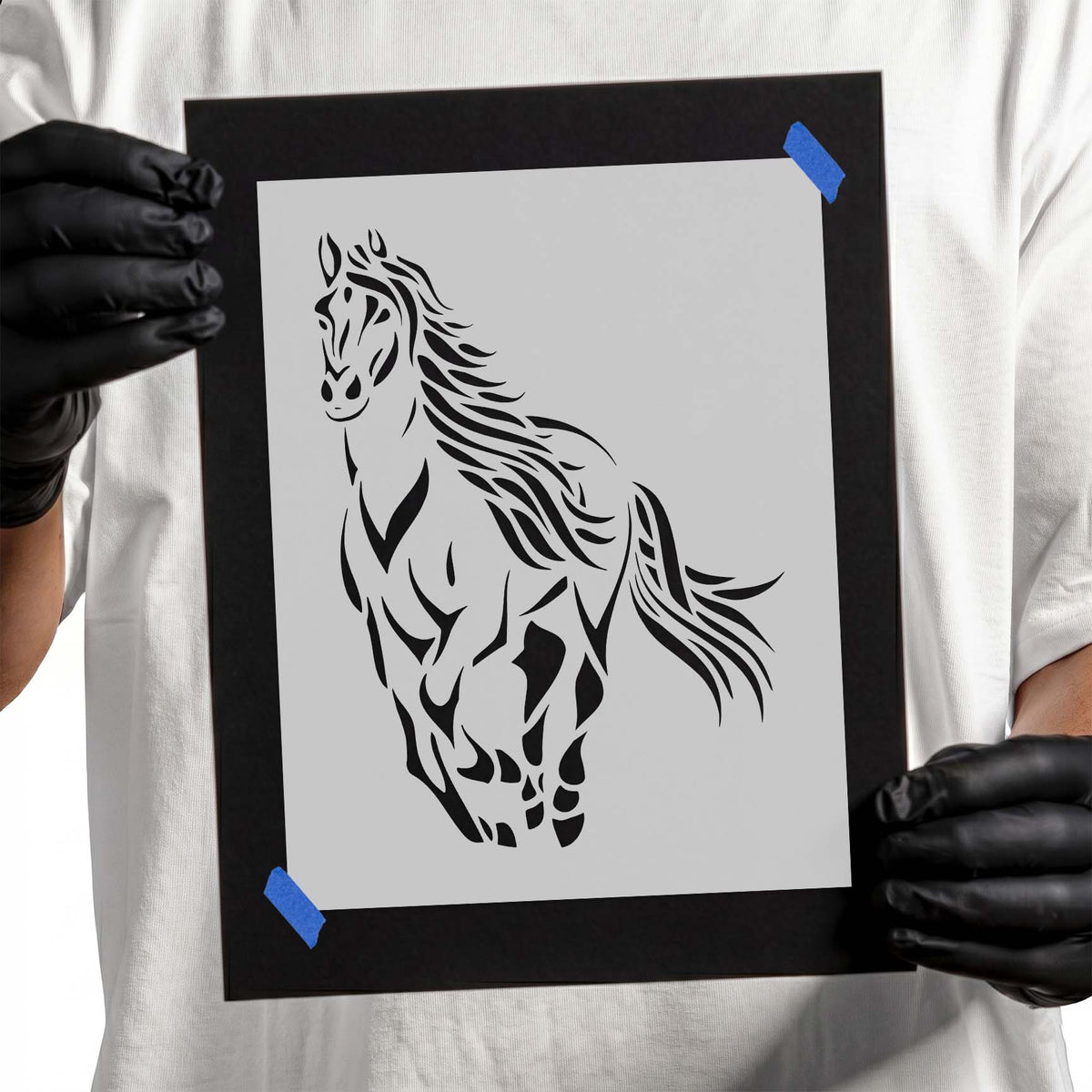 Horse stencil with flowing mane, sweeping tail, and running pose