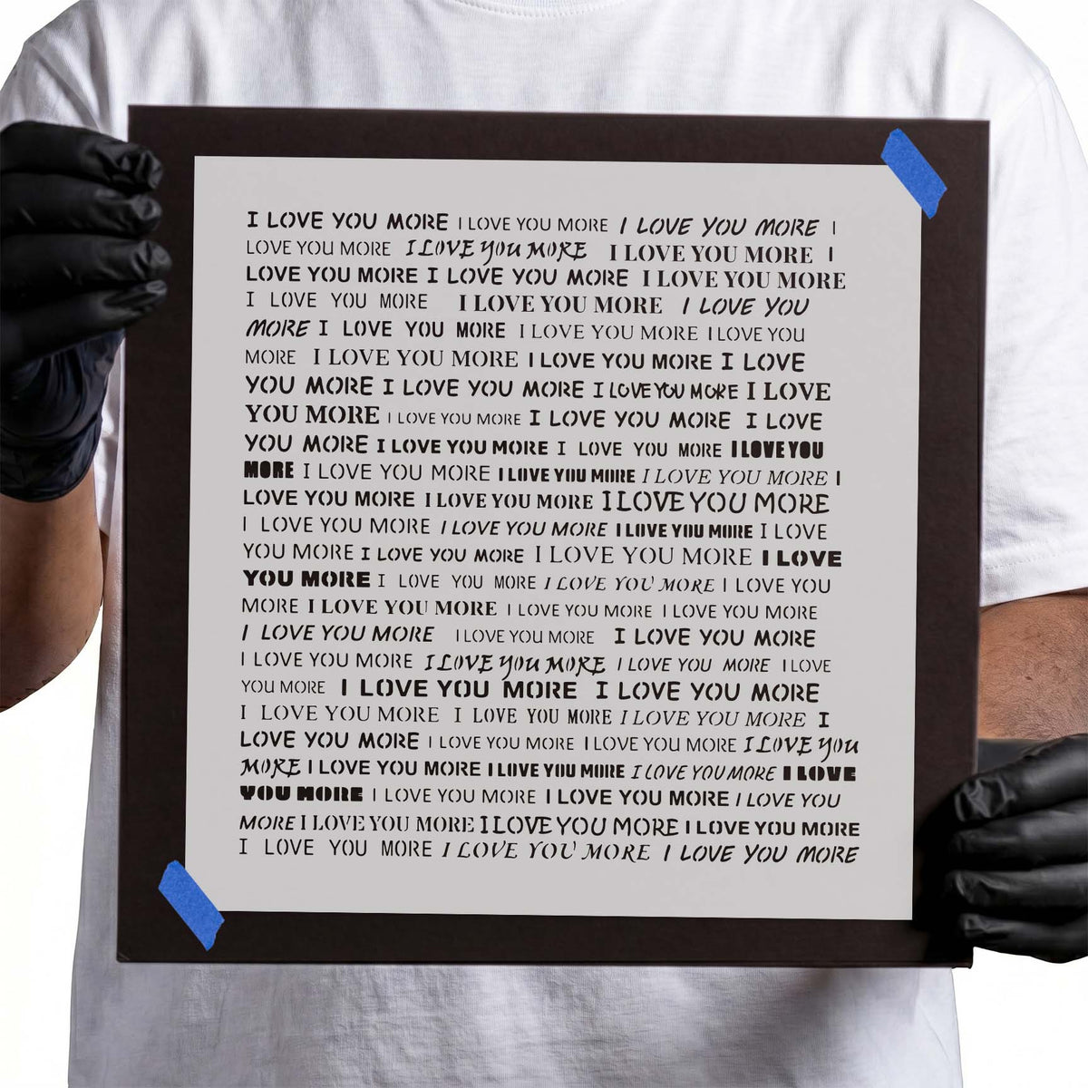 Repeated I Love You More stencil lettering in assorted bold and handwritten fonts