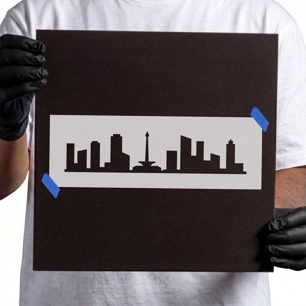 Jakarta skyline stencil with buildings and central monument silhouette