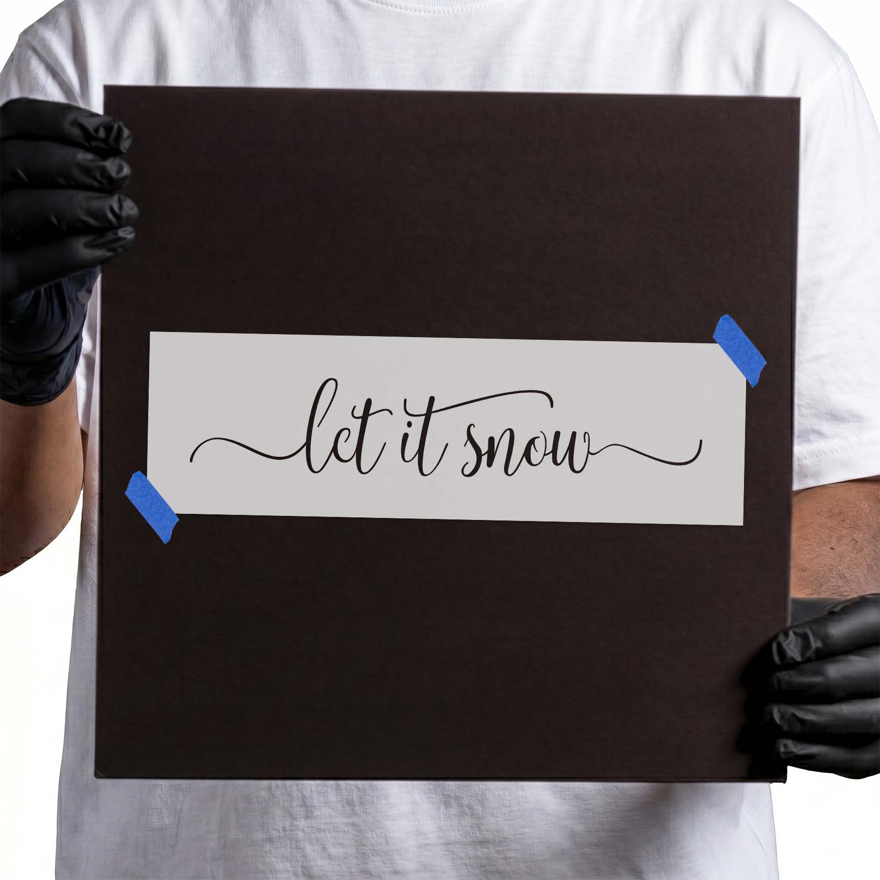 Let it snow stencil with flowing cursive lettering and flourishes