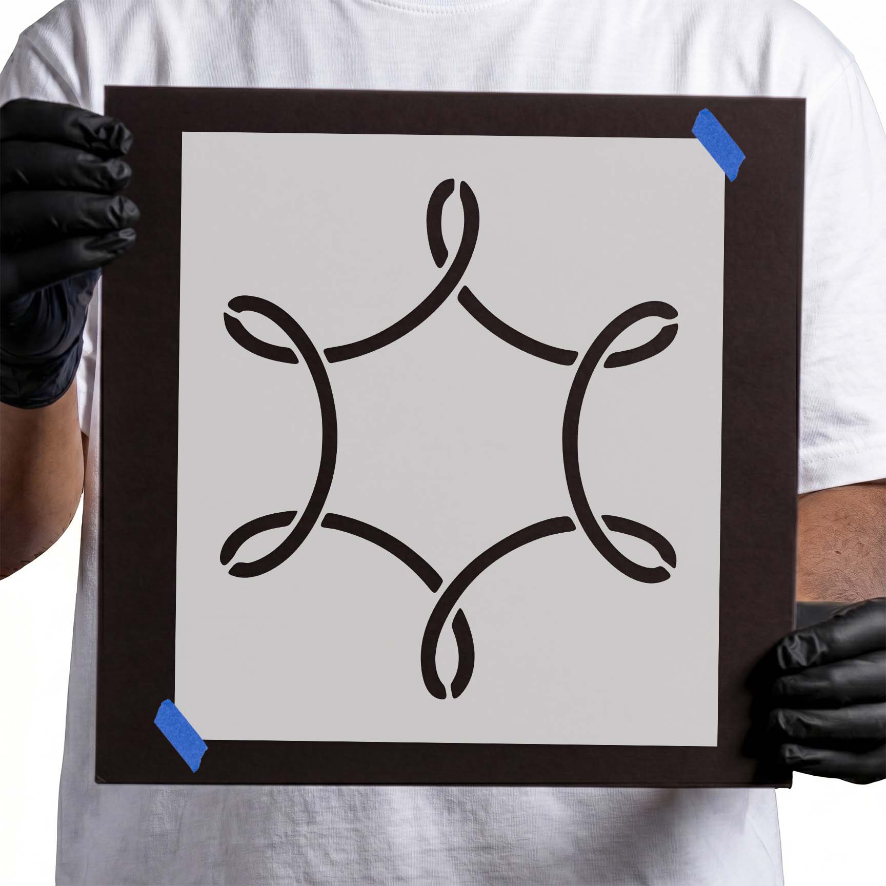 Stencil with symmetrical looping curves and four paired leaf-like shapes