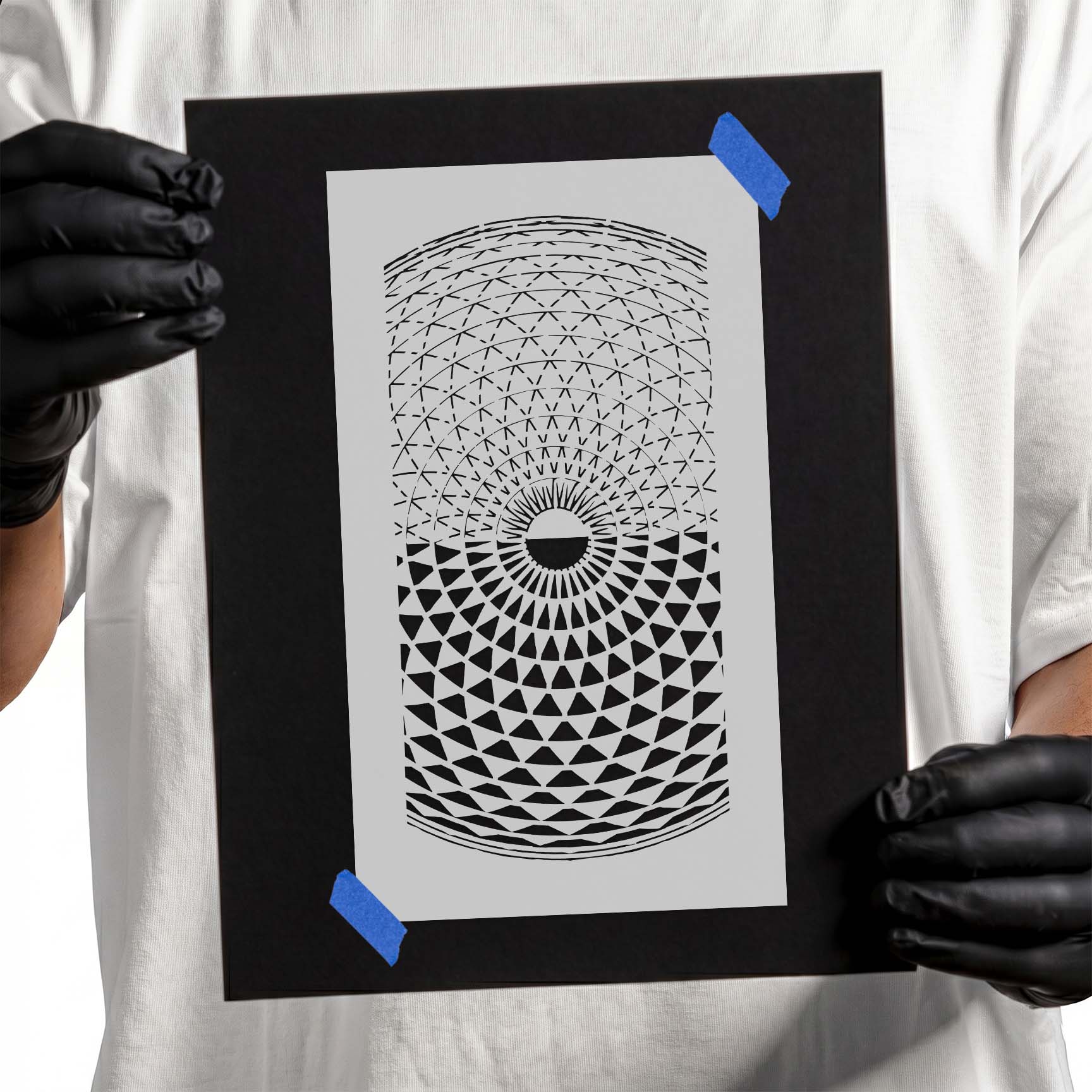 Person holding a reusable Mandala Pattern Stencil