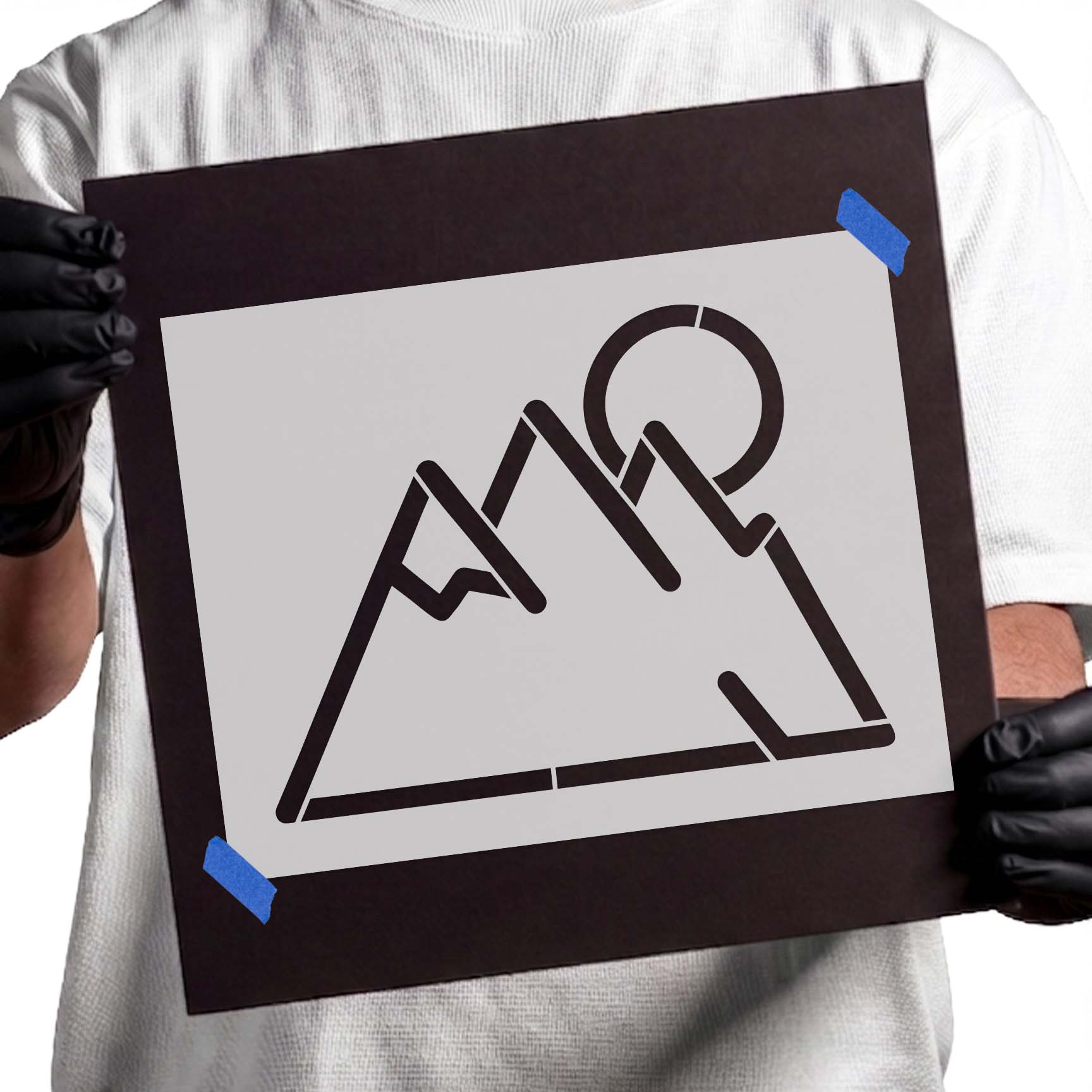 Minimalist mountain stencil with angular peaks and circular sun