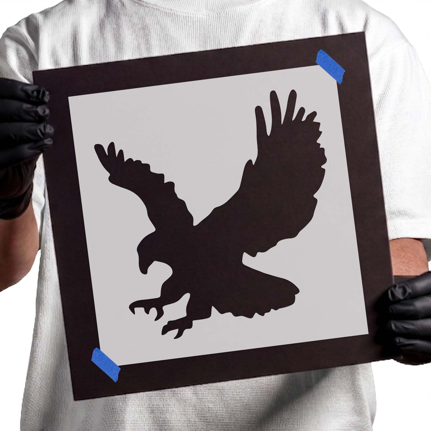 Landing eagle stencil silhouette with spread wings and extended talons