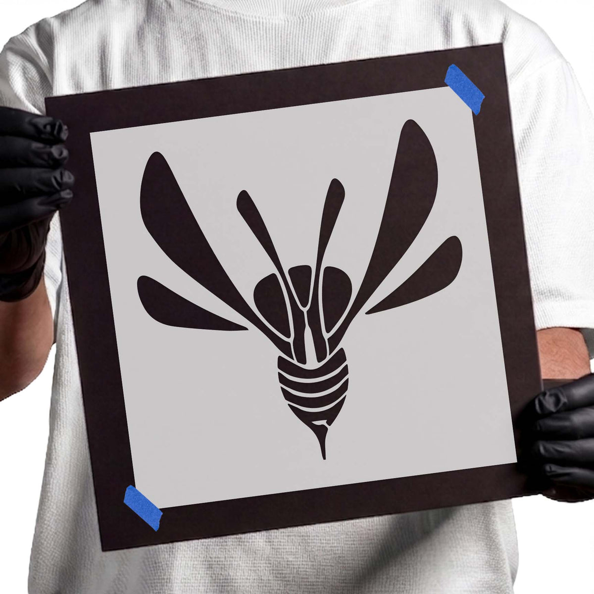Winged wasp stencil with striped body and six extended wings