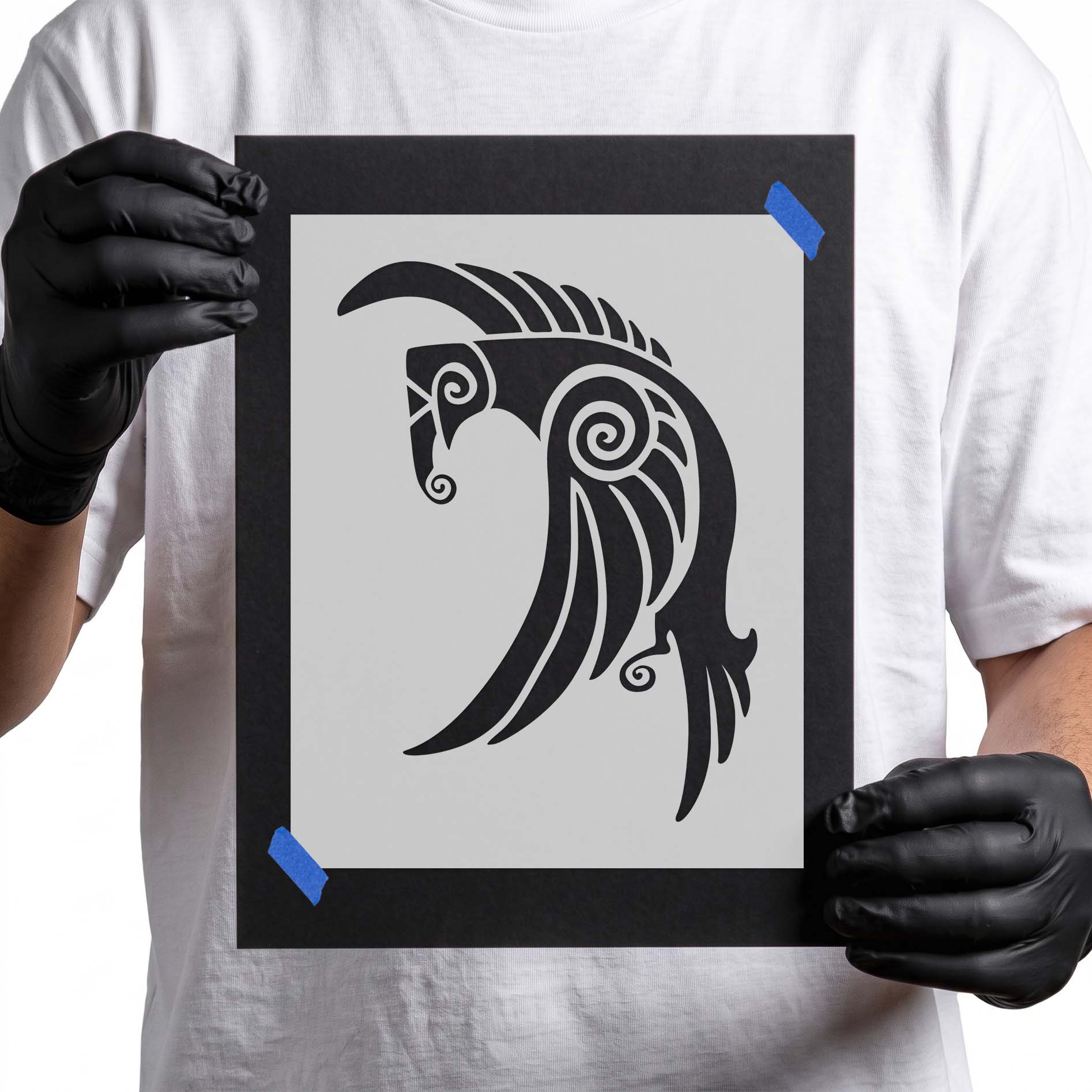 Stylized raven stencil with spiral details and sweeping feather shapes