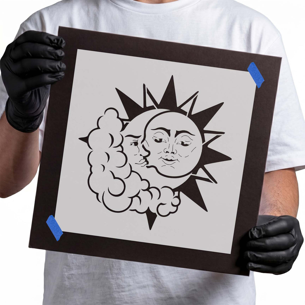 Celestial stencil with sun and crescent moon faces among clouds