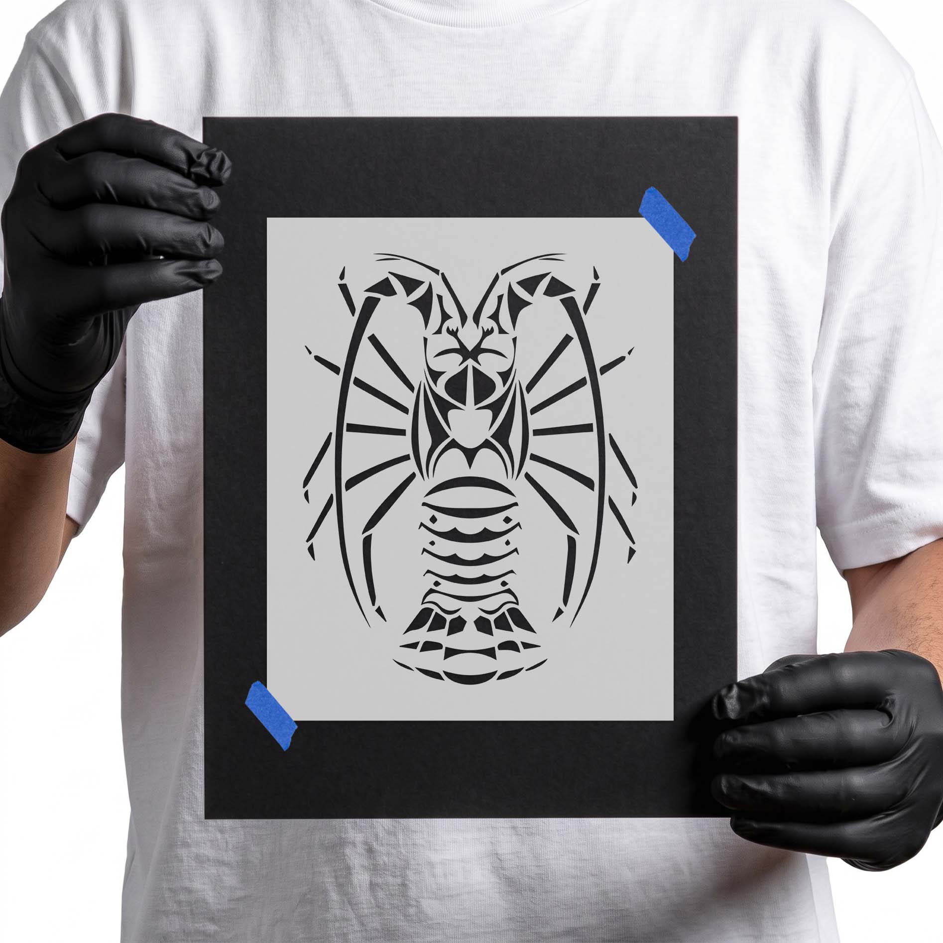 Person holding reusable Tribal Lobster Stencil