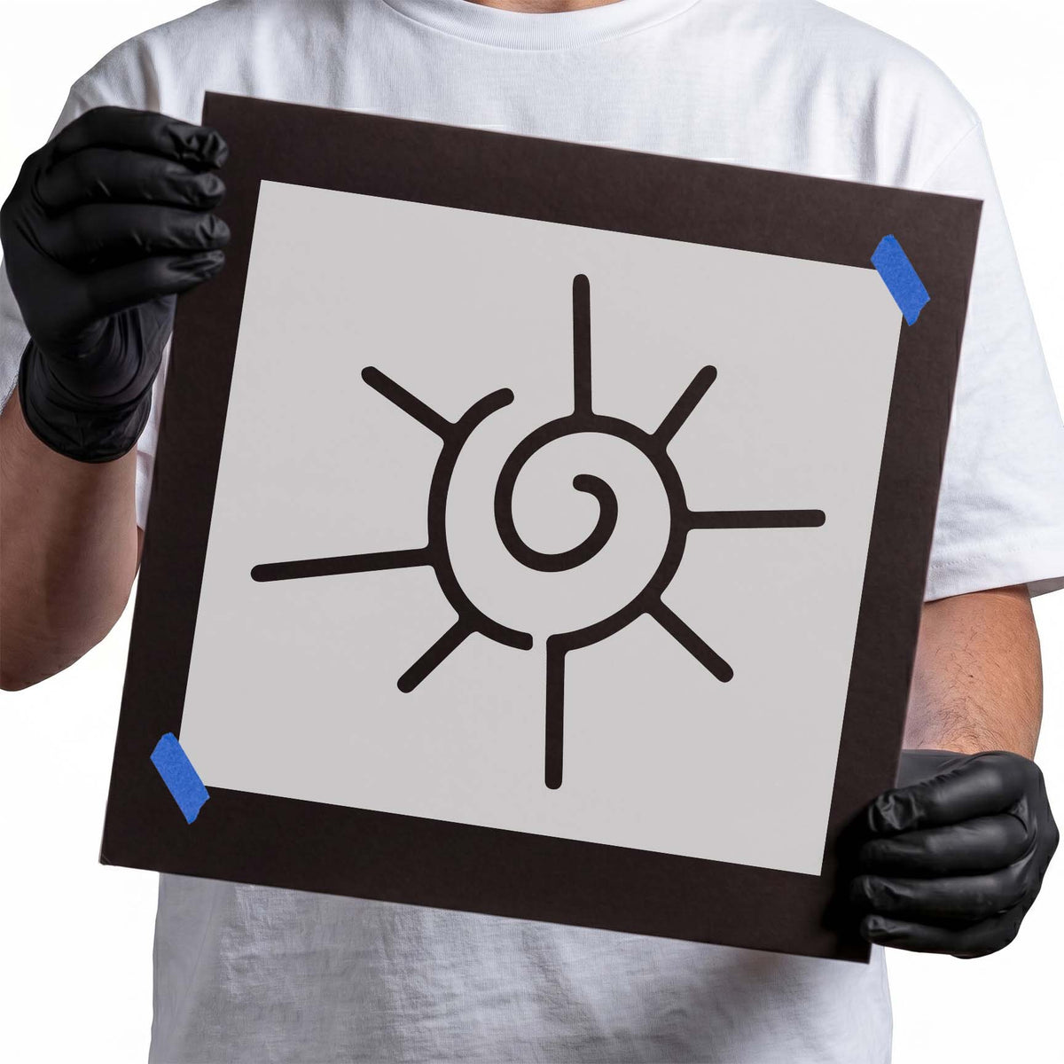 Swirly sun stencil with spiral center and uneven radiating rays