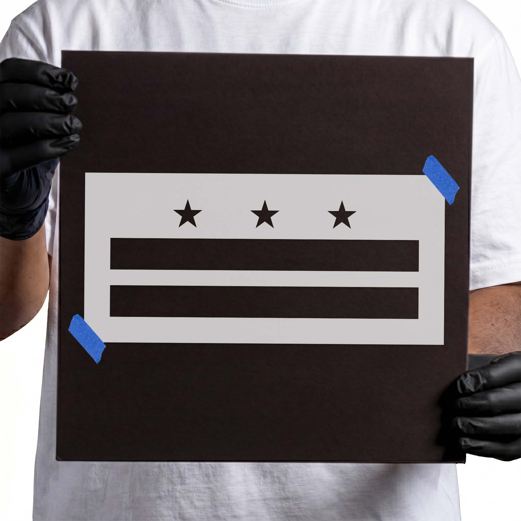Person holding reusable Washington, D.C. City Flag Stencil