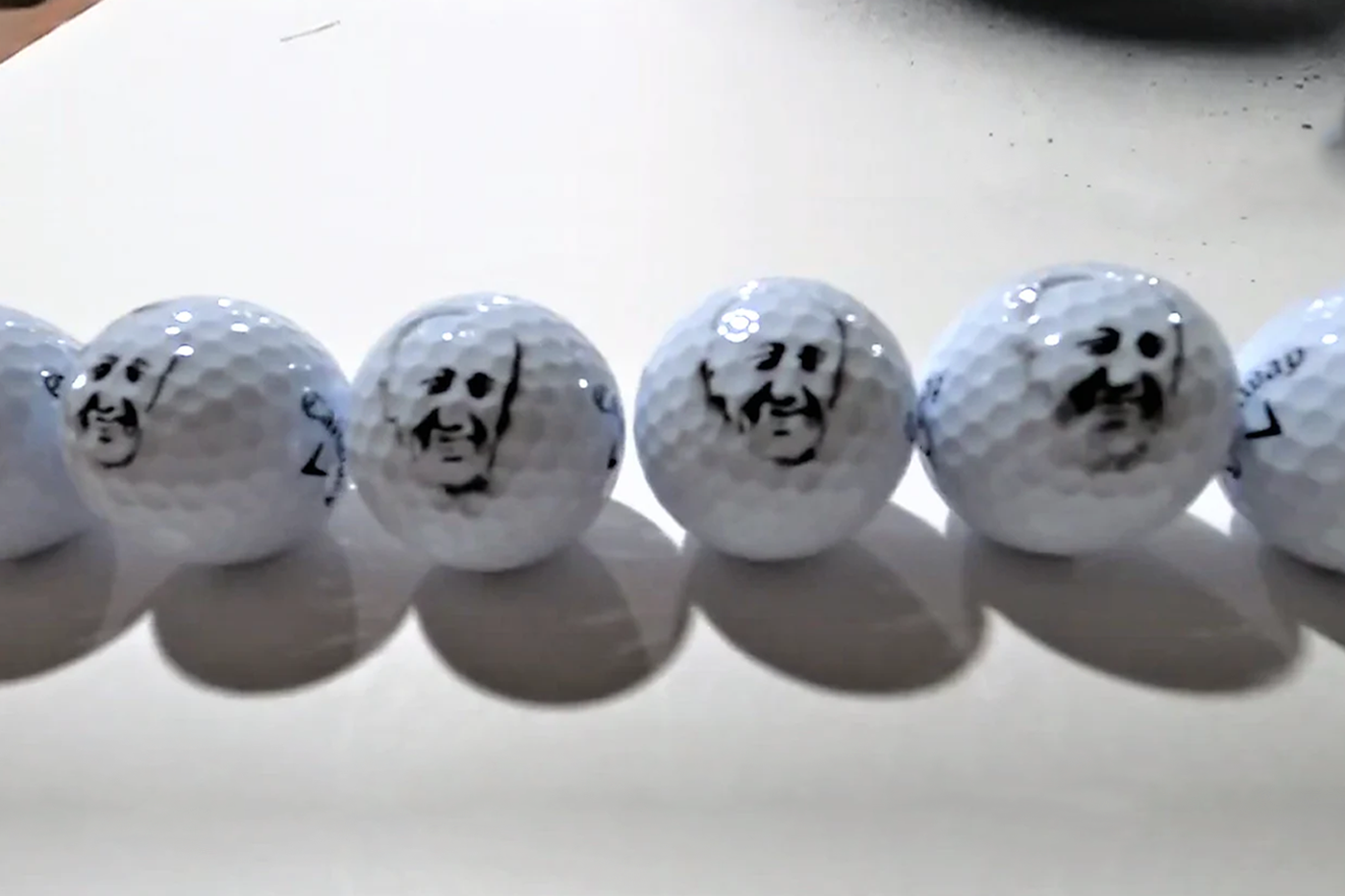 STENCIL STOP | Custom painted golf balls with face 