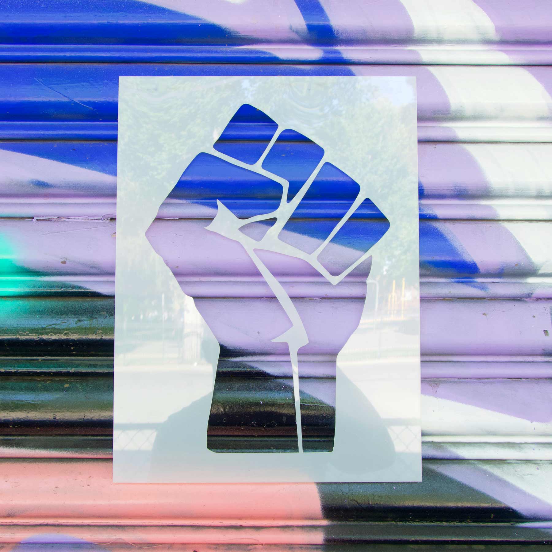 Raised Fist Stencil on Painted Wall