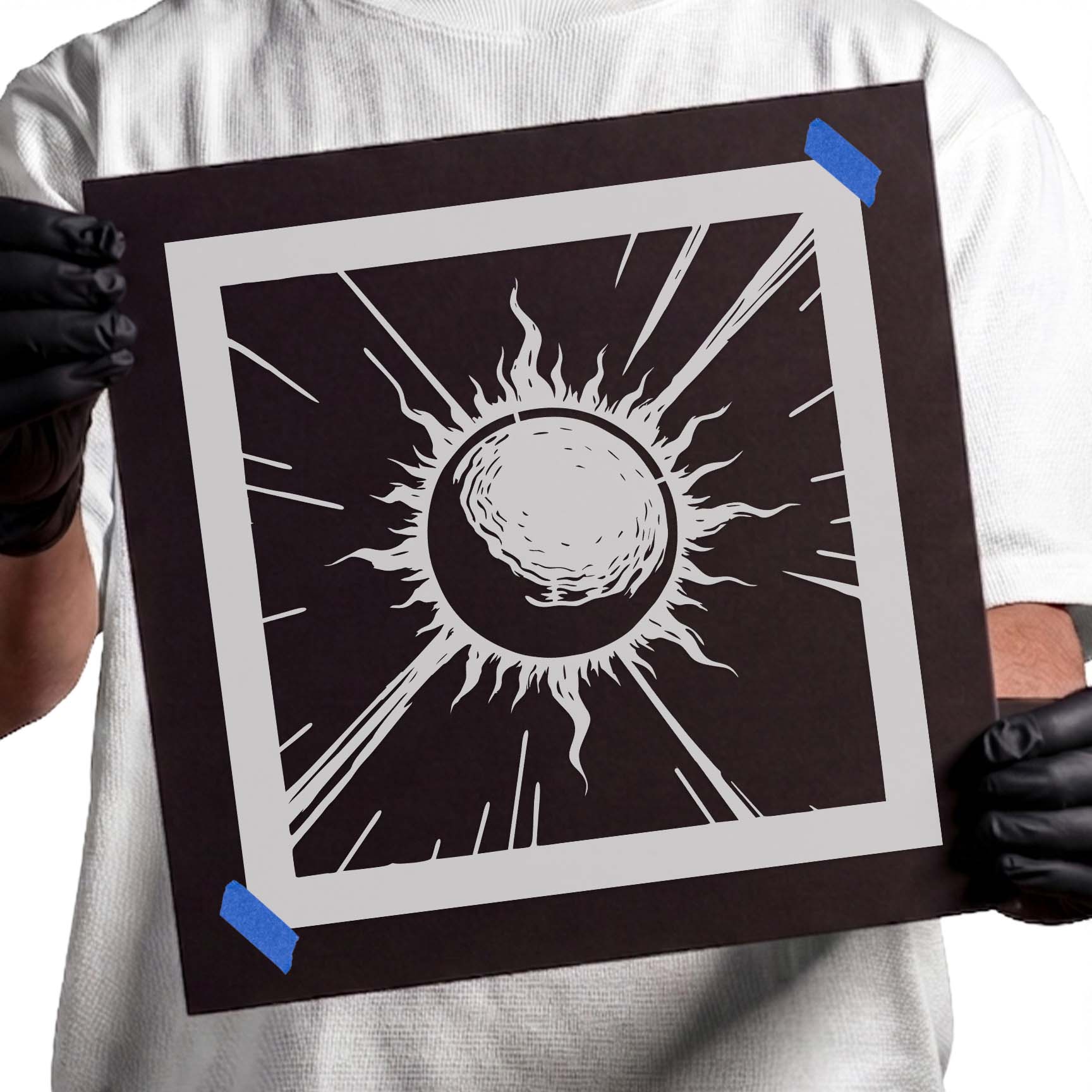 Partially eclipsed sun with radiant sunburst rays stencil design
