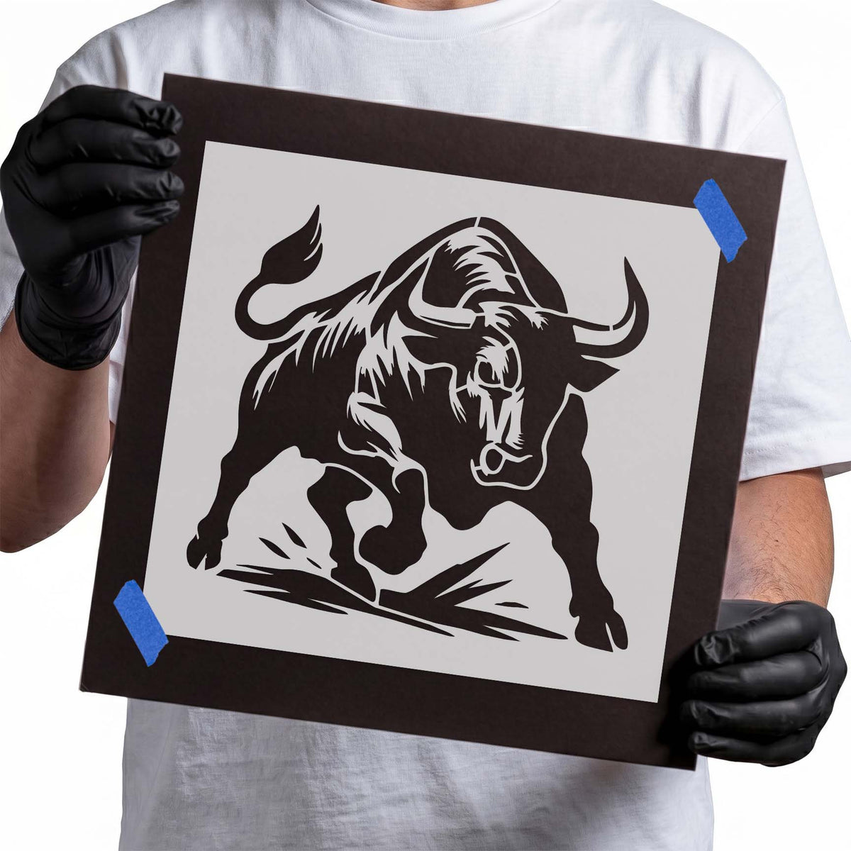 Charging bull silhouette stencil with muscular forward stance