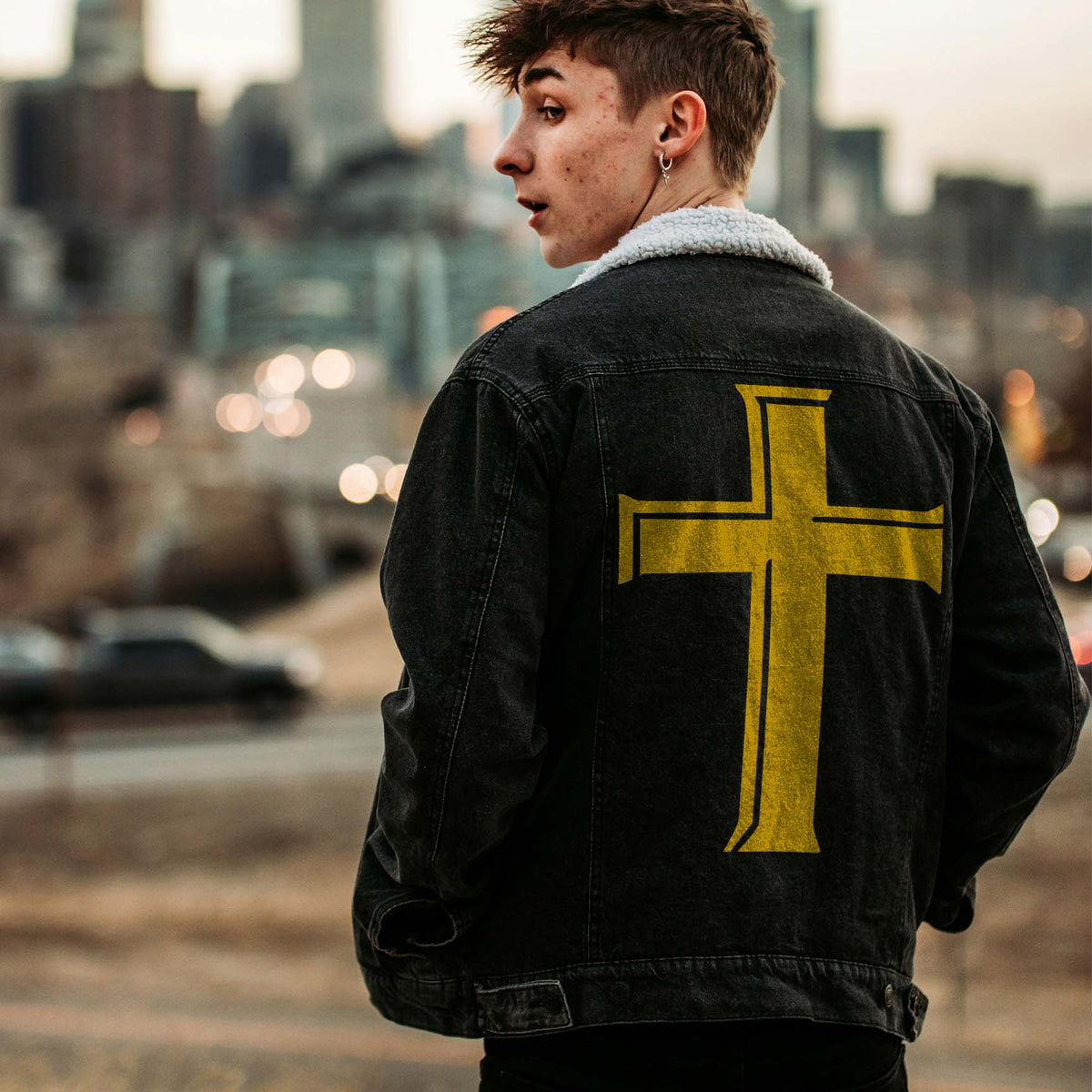 Streetwear meets bold symbolism with the Classic Latin Cross Stencil in yellow on a black denim jacket.