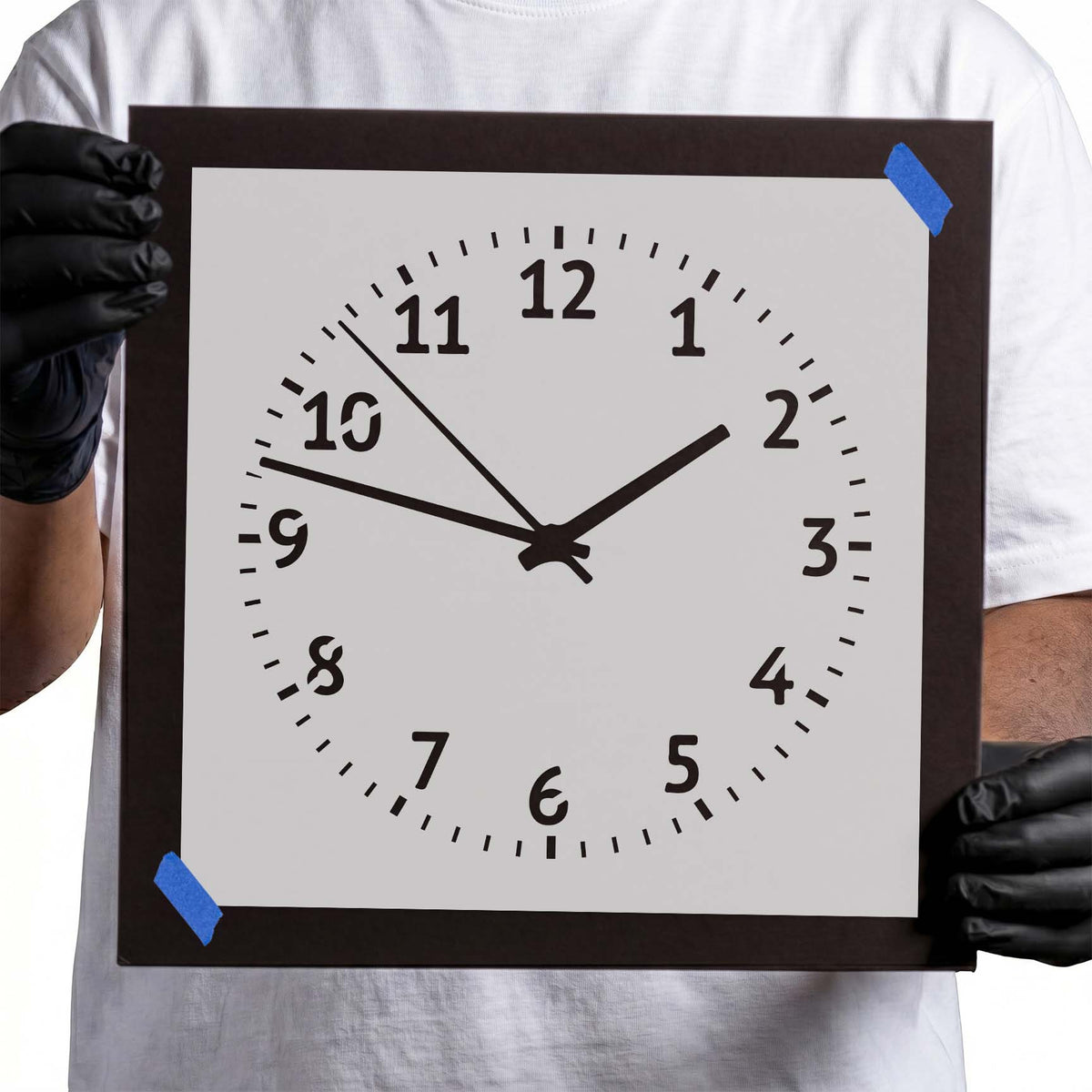 Analog clock stencil with numbered circular dial, minute markers, and three hands