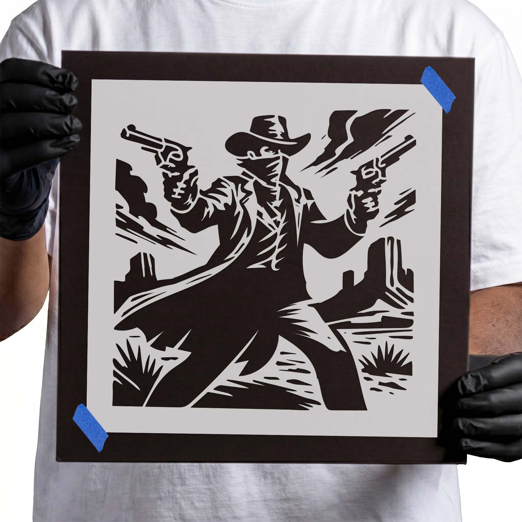 Masked cowboy with dual revolvers in a desert stencil design
