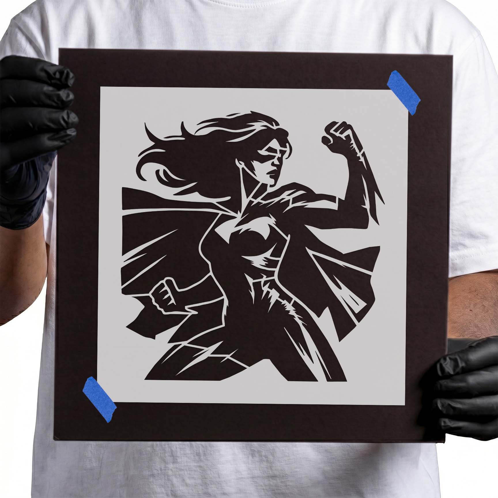 Female superhero with flowing cape and raised fist stencil