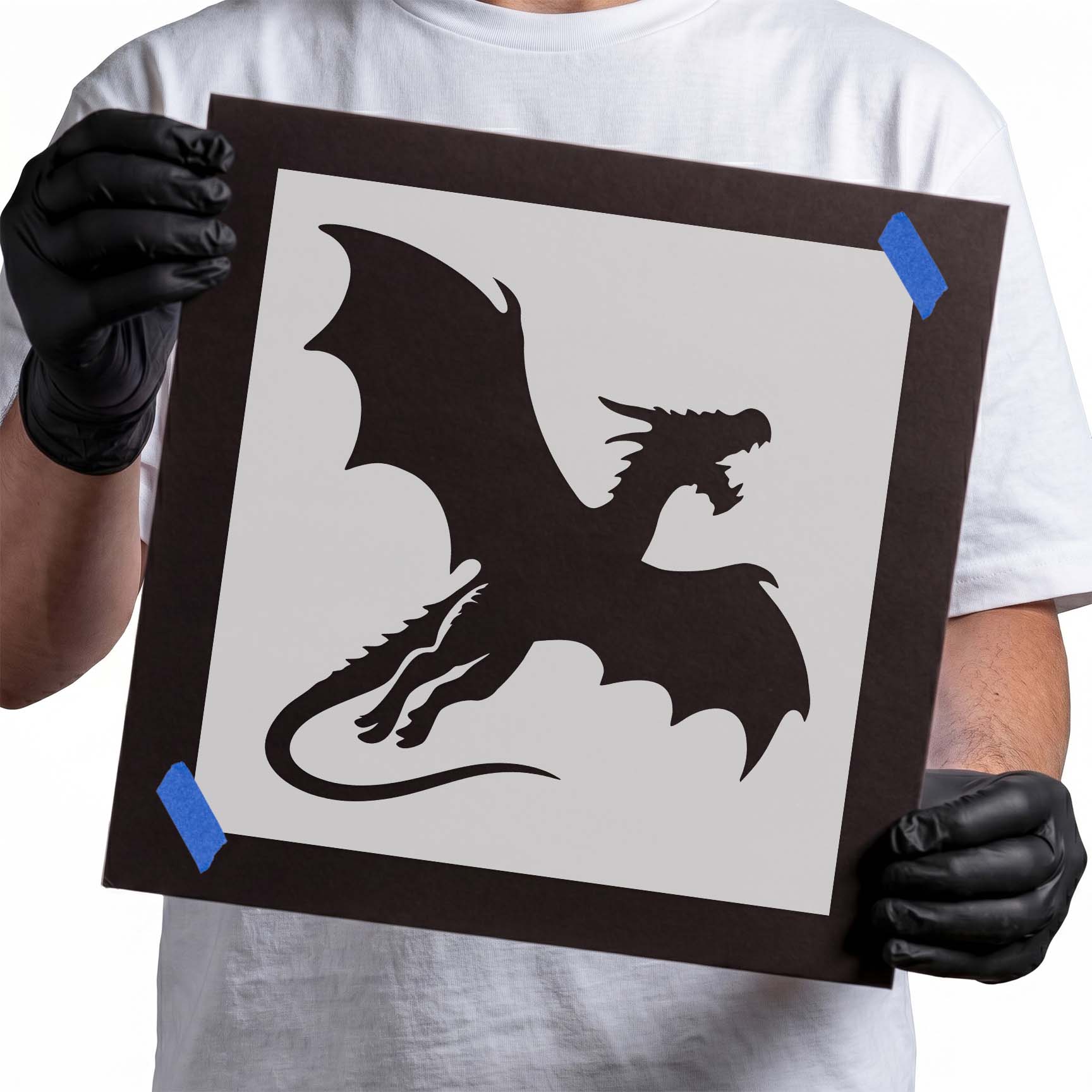 Flying dragon stencil with spread wings, open jaws, claws, and curved tail
