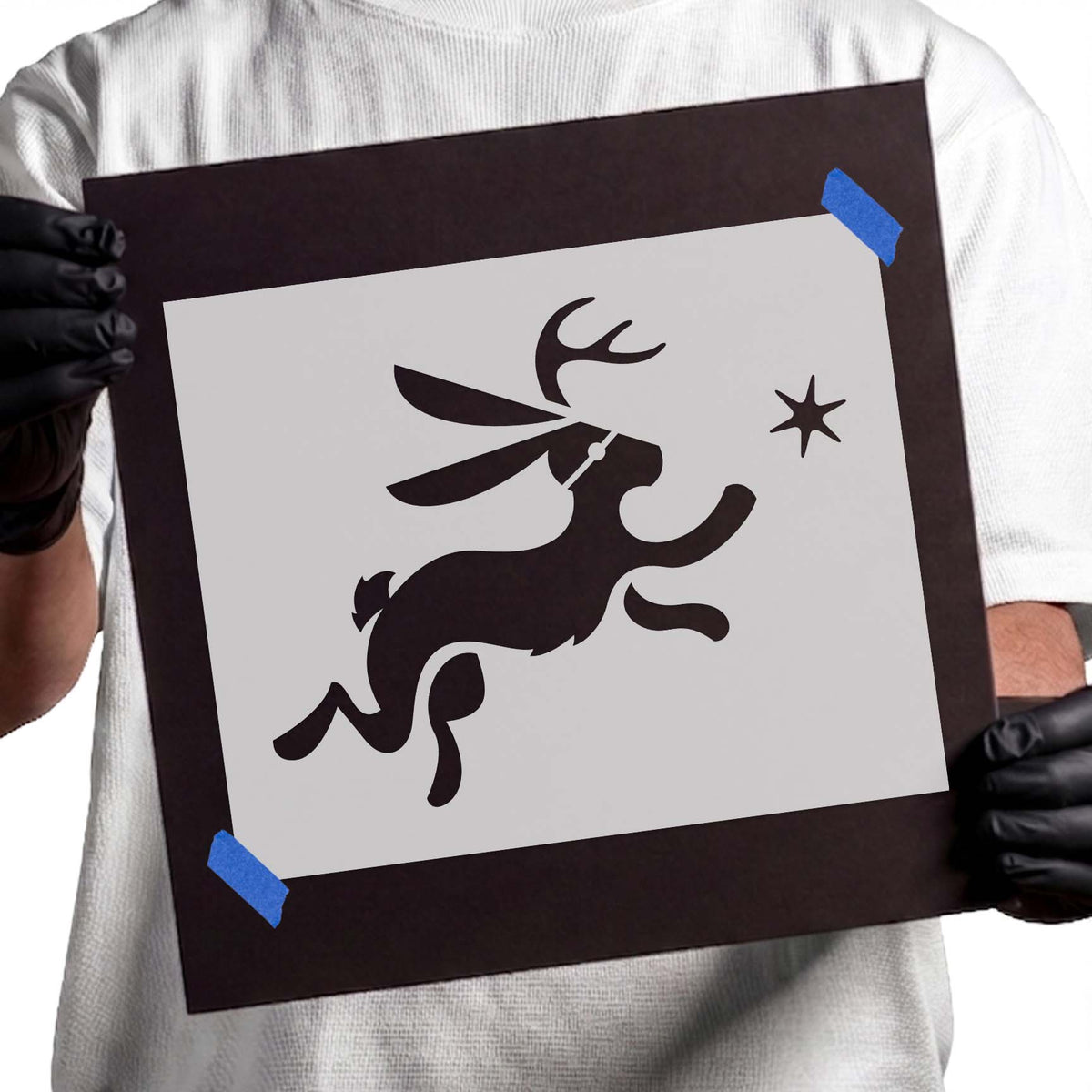 Leaping jackalope stencil with branching antlers, flowing ears, extended legs, and a small star