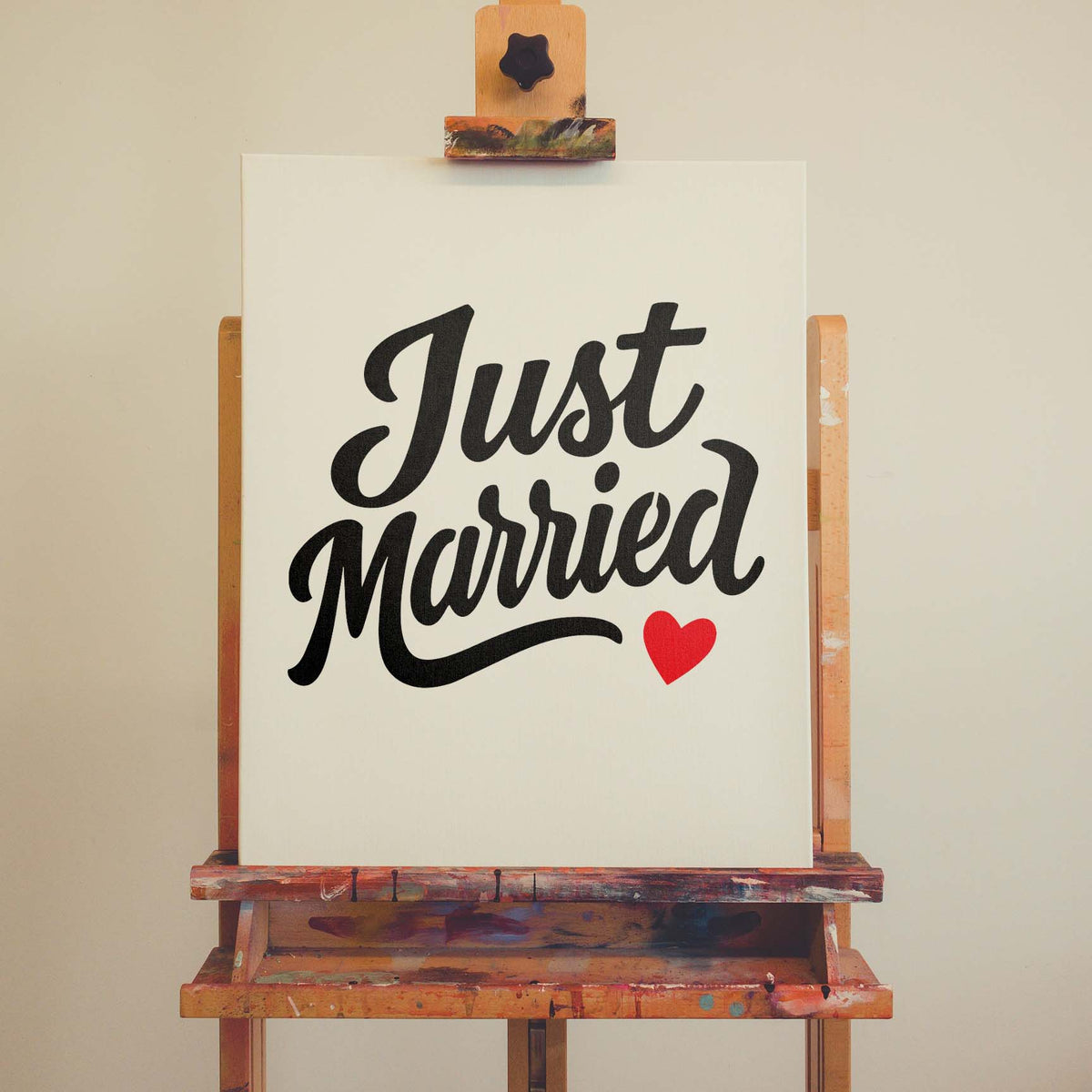 Just Married Script stencil with sweeping lettering and red heart on canvas