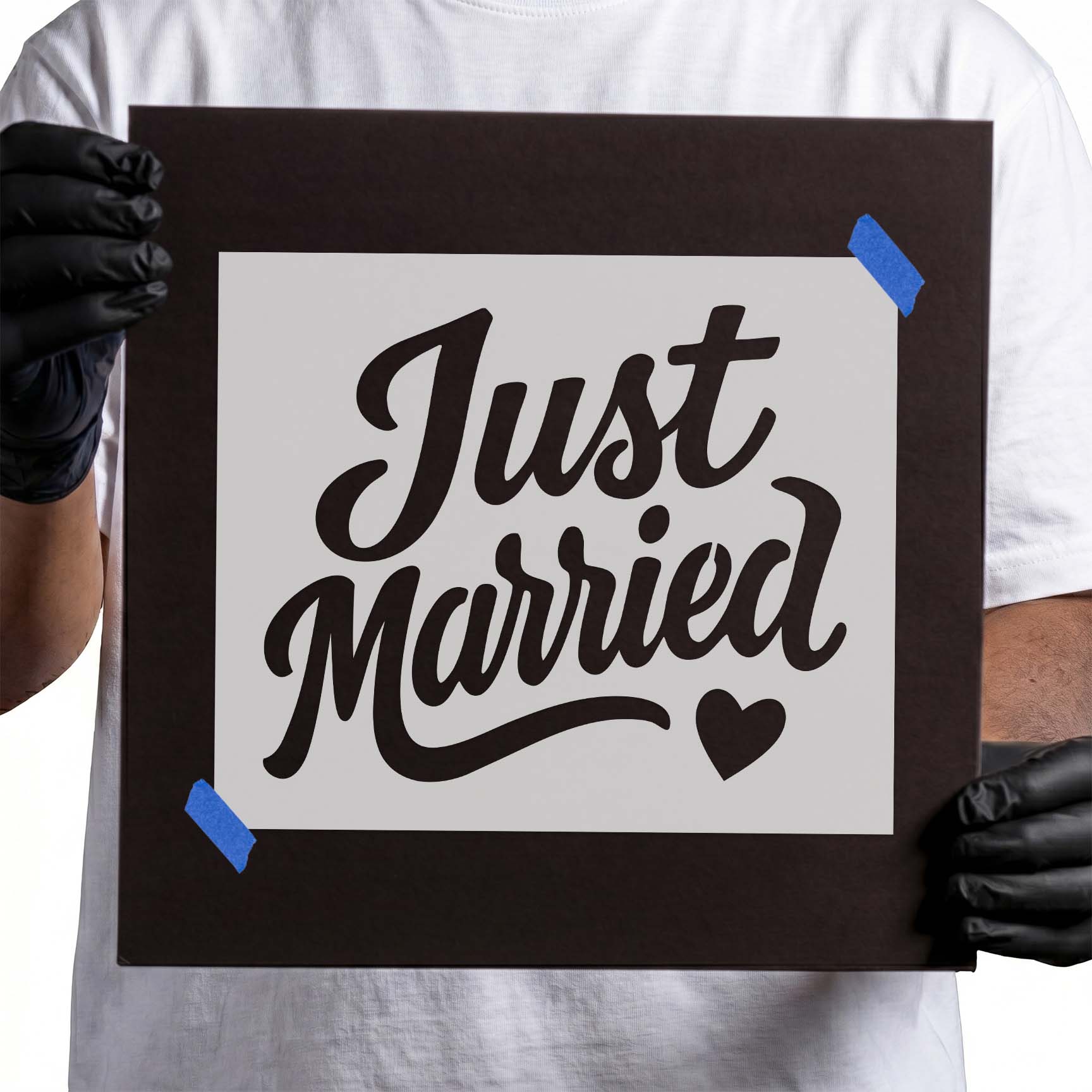 Just Married Script Stencil featuring elegant handwritten lettering with a small heart accent.