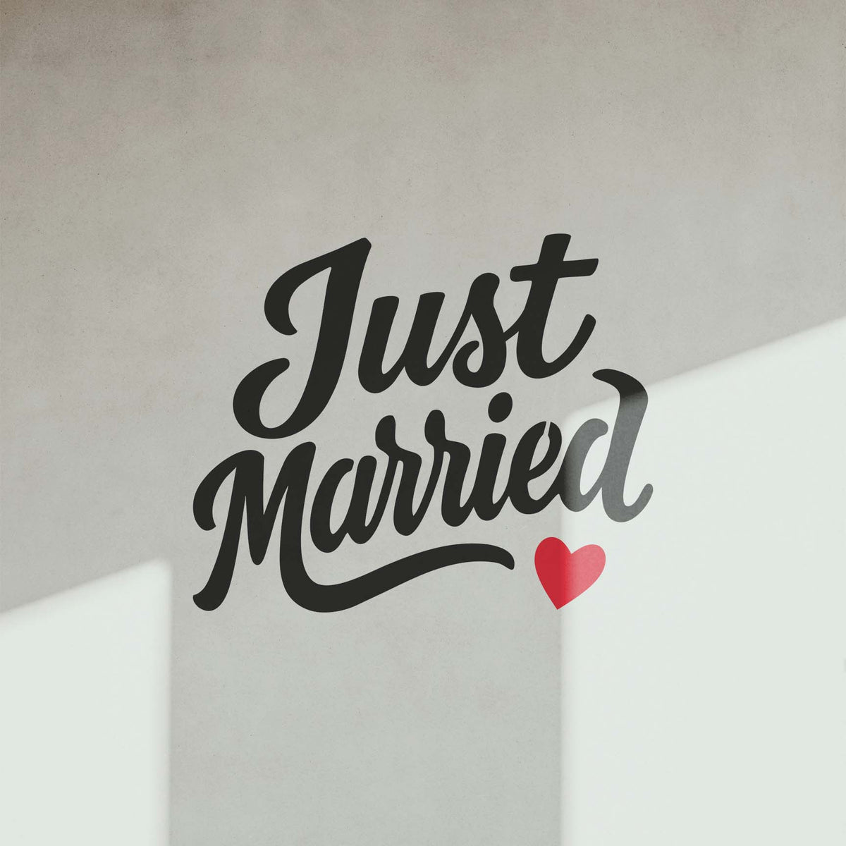 Just Married Script stencil with bold lettering and red heart on modern wall
