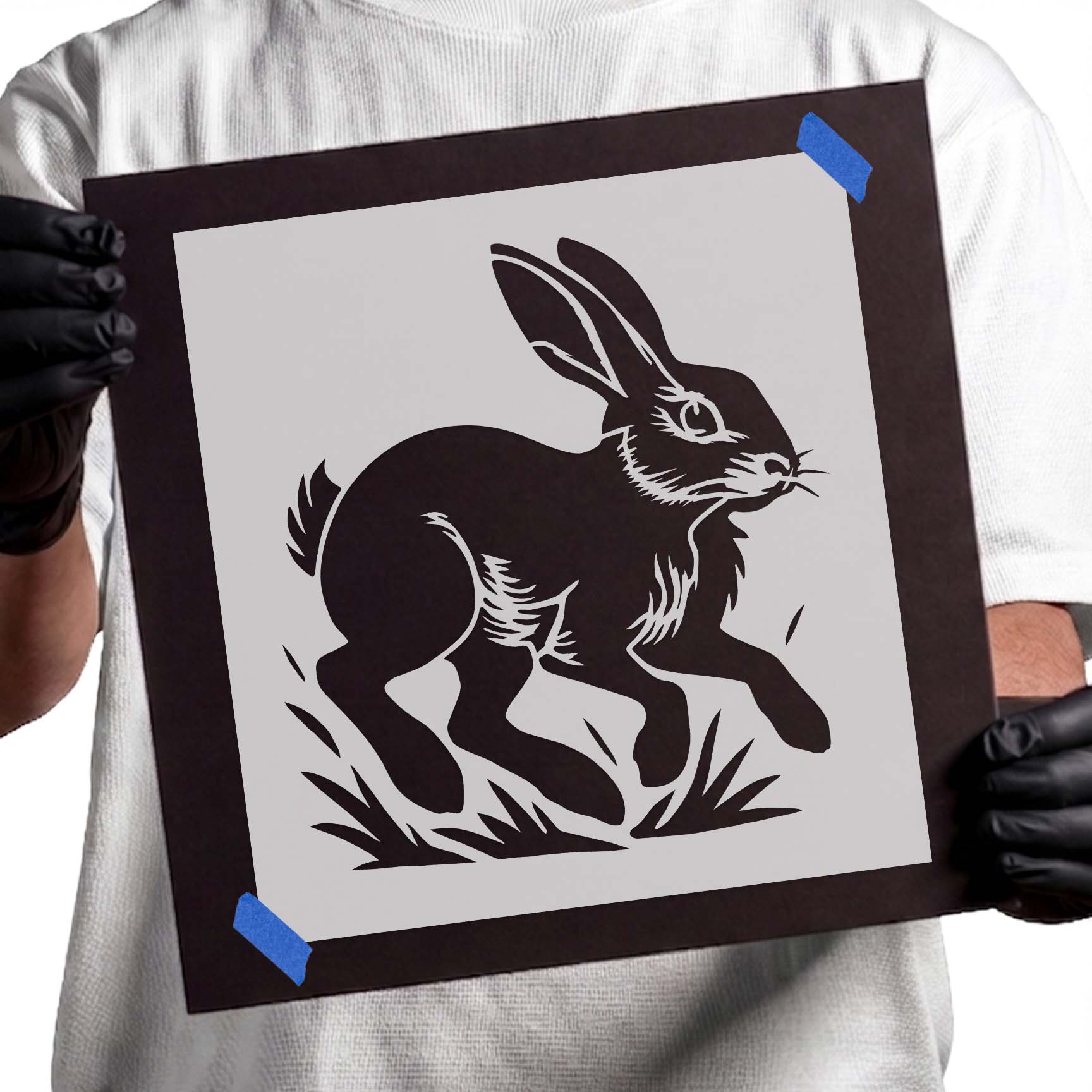 Leaping rabbit stencil with upright ears in mid-jump