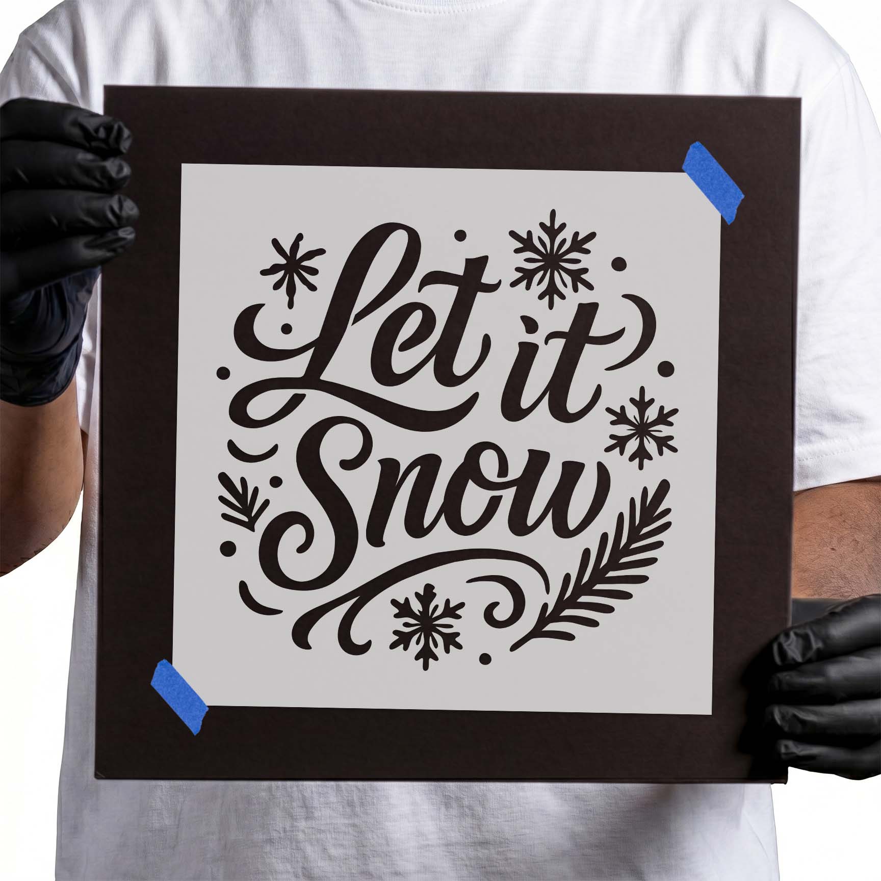 Let It Snow Holiday Stencil featuring festive lettering with snowflakes and winter foliage.
