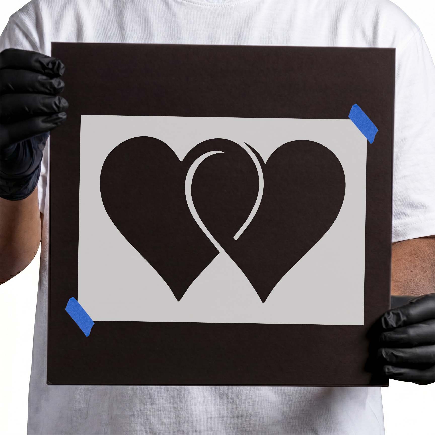 Two linked heart silhouettes forming a simple romantic design
