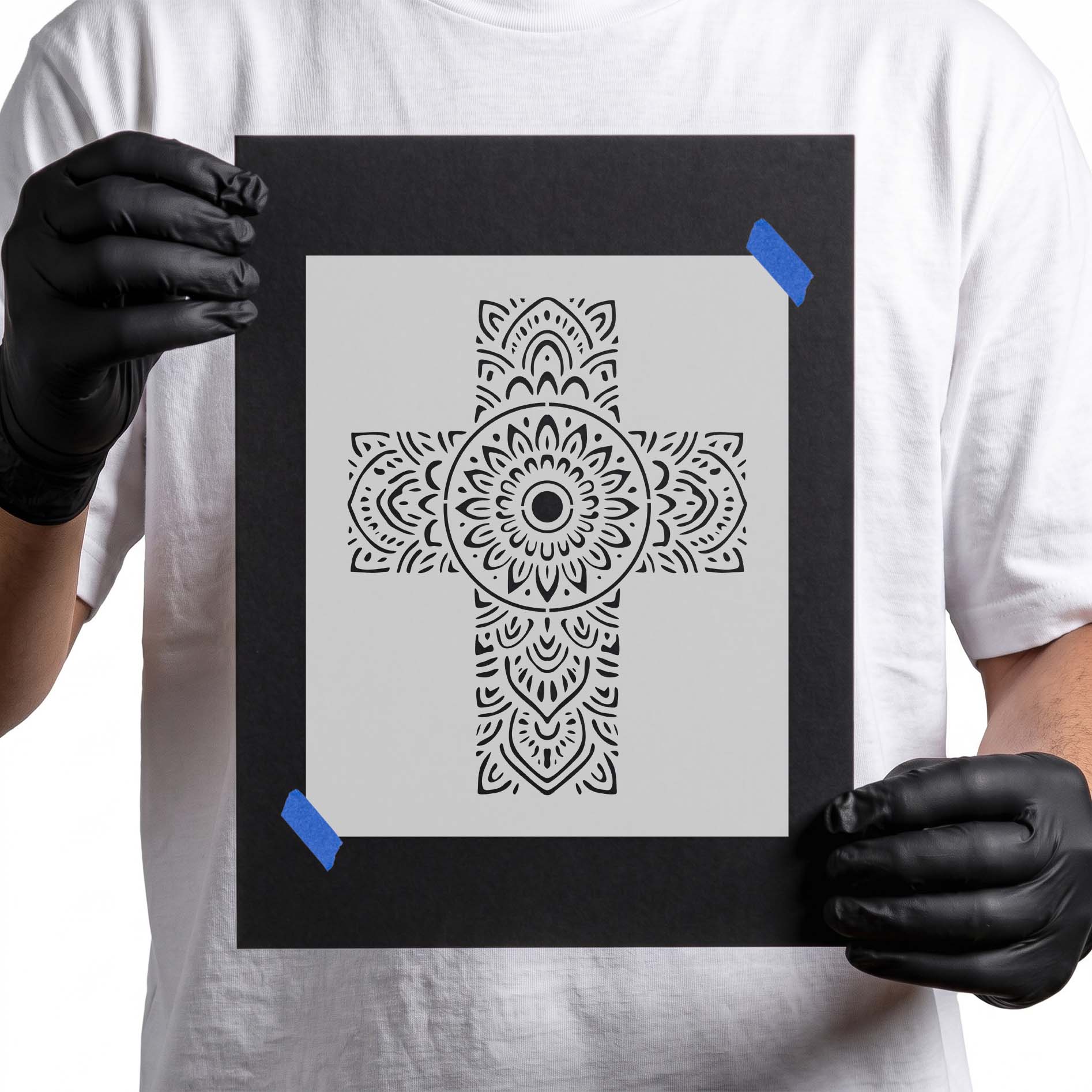 Christian cross filled with intricate floral mandala patterns and symmetrical details.
