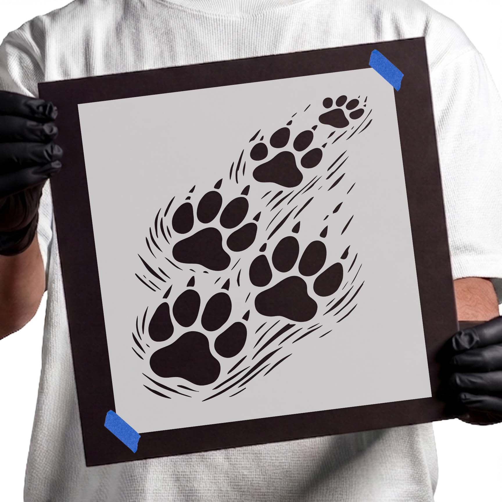 Multiple paw prints stencil arranged in a winding animal track trail