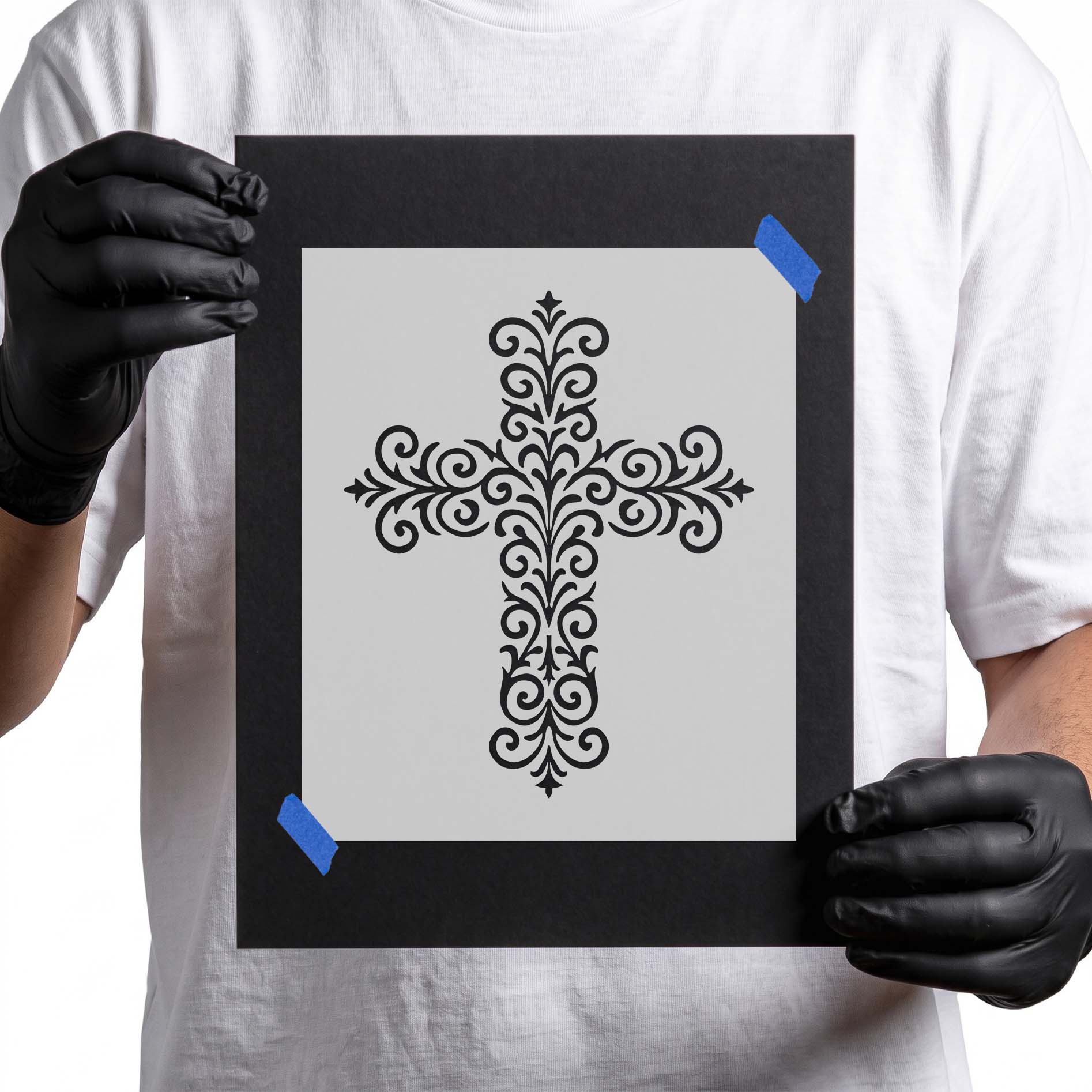 Decorative Christian cross with elegant filigree scrollwork and ornate details.
