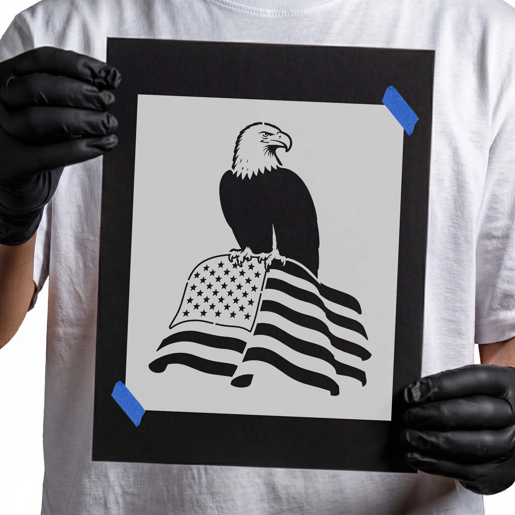 Bald eagle perched above a waving American flag patriotic stencil design
