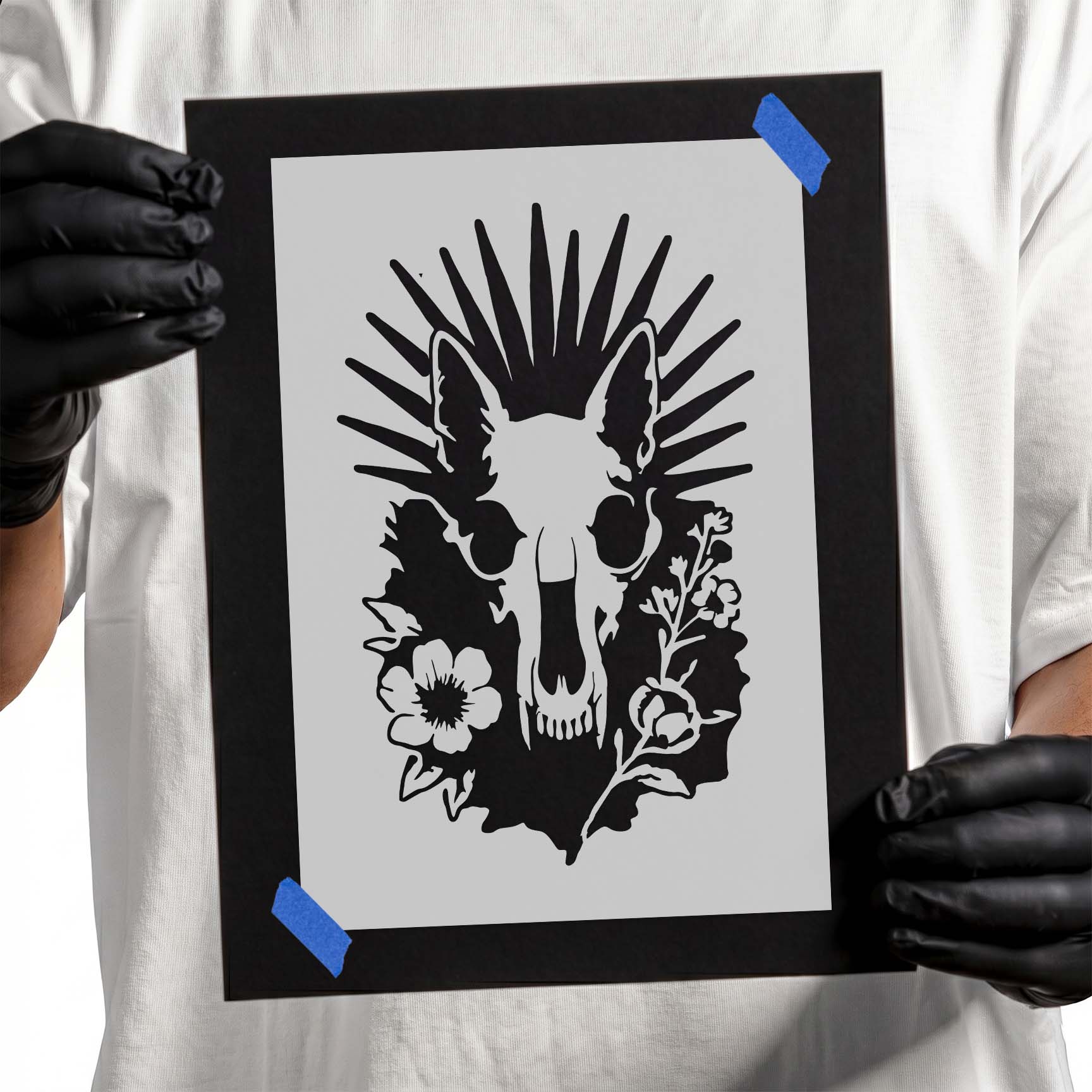 Animal skull with wildflowers and radiant sunburst stencil design