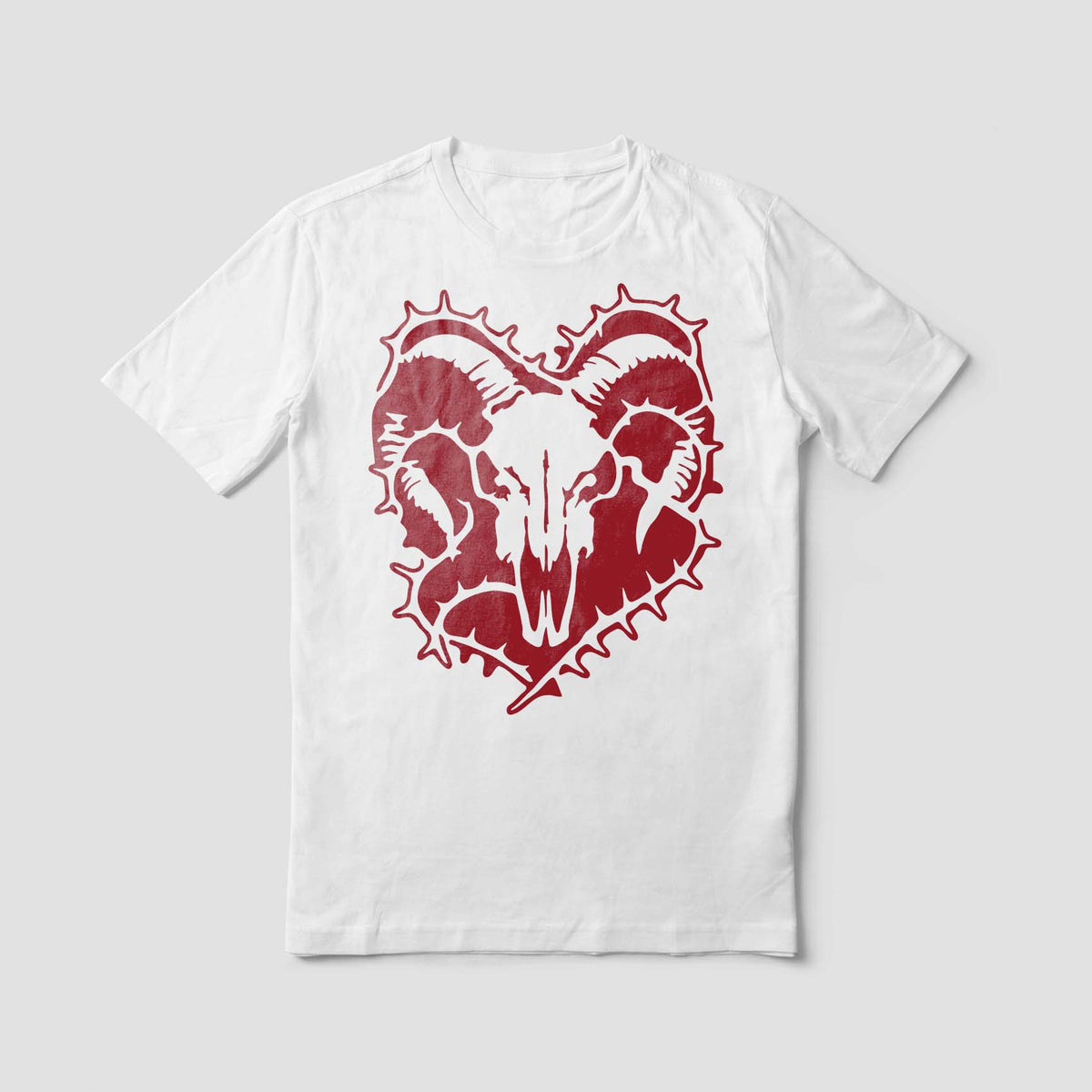 Bold red Ram Skull Thorn Wreath Stencil centers a horned skull design on a crisp white shirt