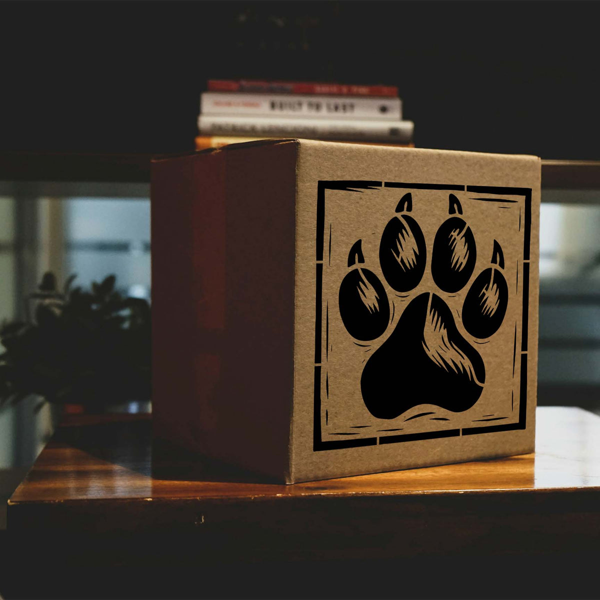Rustic Bear Paw Print Frame Stencil with claw details displayed on a cardboard box
