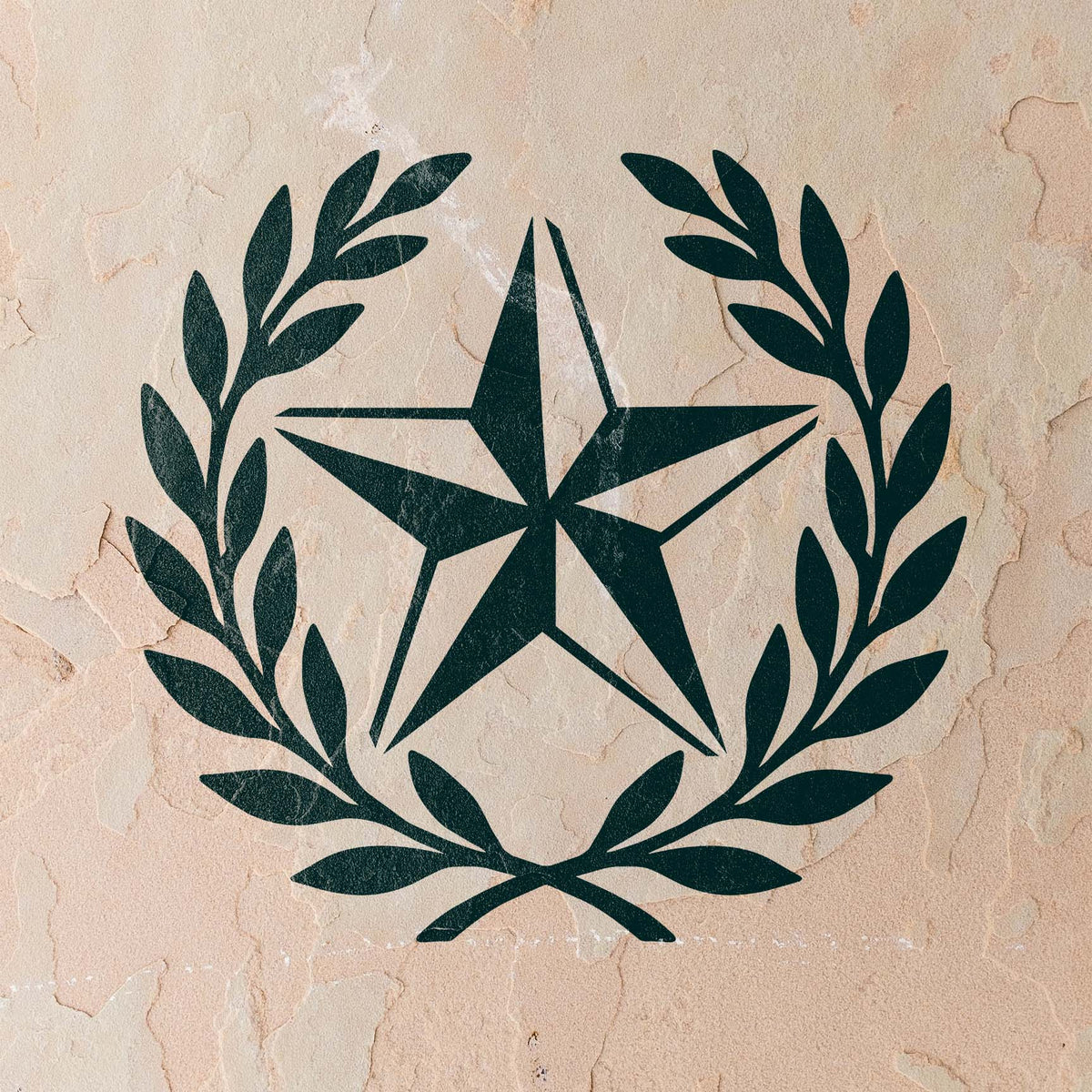 Rustic Star Laurel Wreath Stencil painted in deep green across a weathered stucco wall